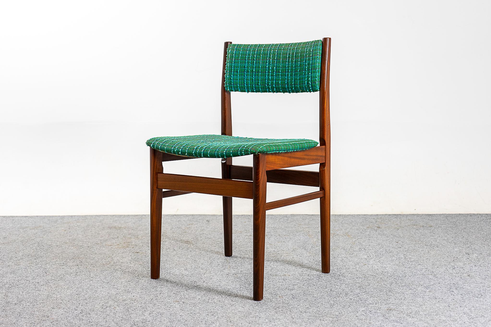 Teak dining chairs, circa 1960s. Beautifully curved backrests and generous seat design provide support and comfort. Solid wood legs feature cross braces for added stability and support. Host the dinner party you've always wanted to!

Unrestored