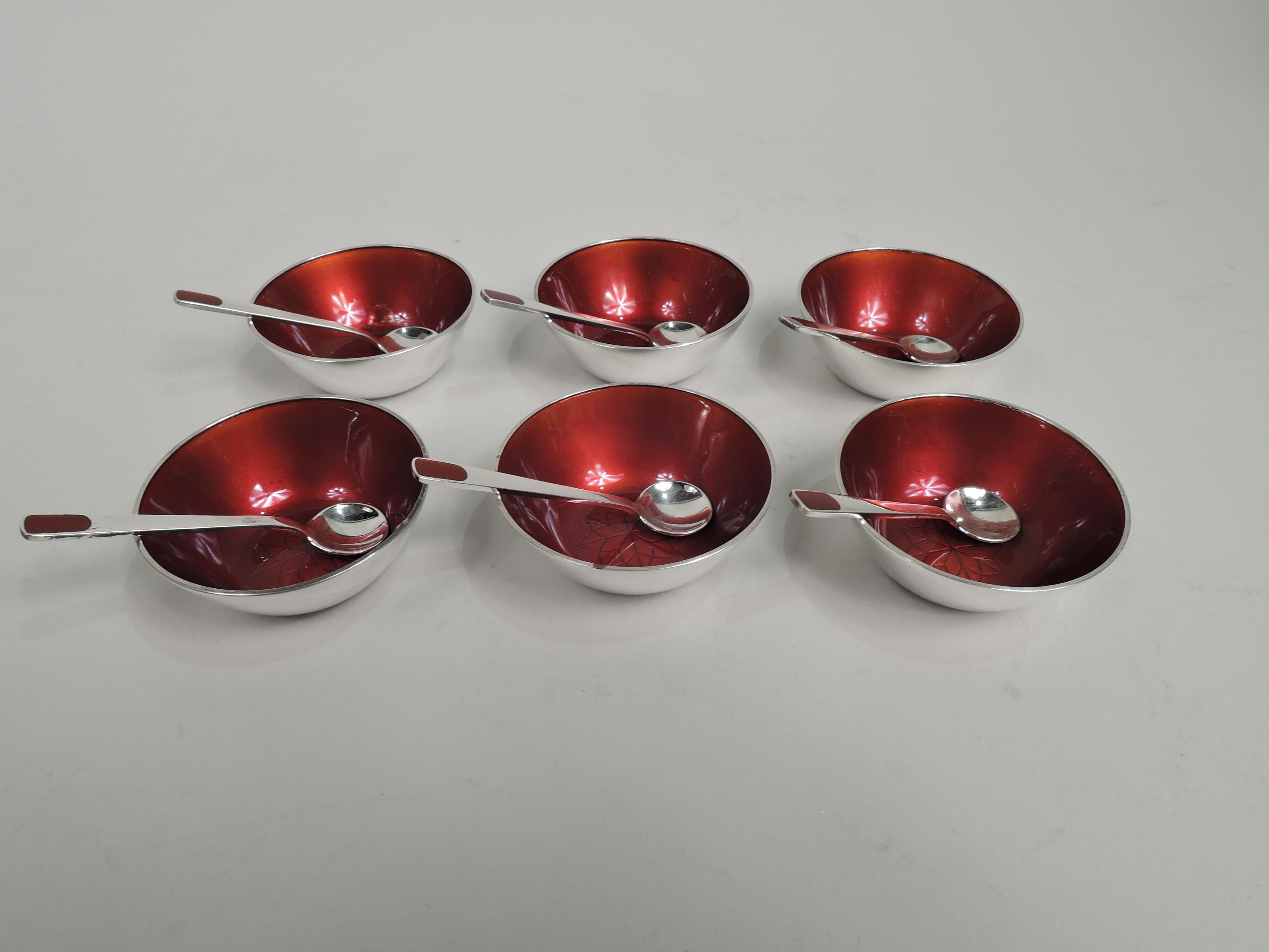 Set of 6 Mid-Century Modern sterling silver open salts with under plates and spoons. Made by Anton Michelsen in Copenhagen. Each salt: Round bowl with enameled interior and engraved and stylized flower head in well. Each plate: Round; gently concave