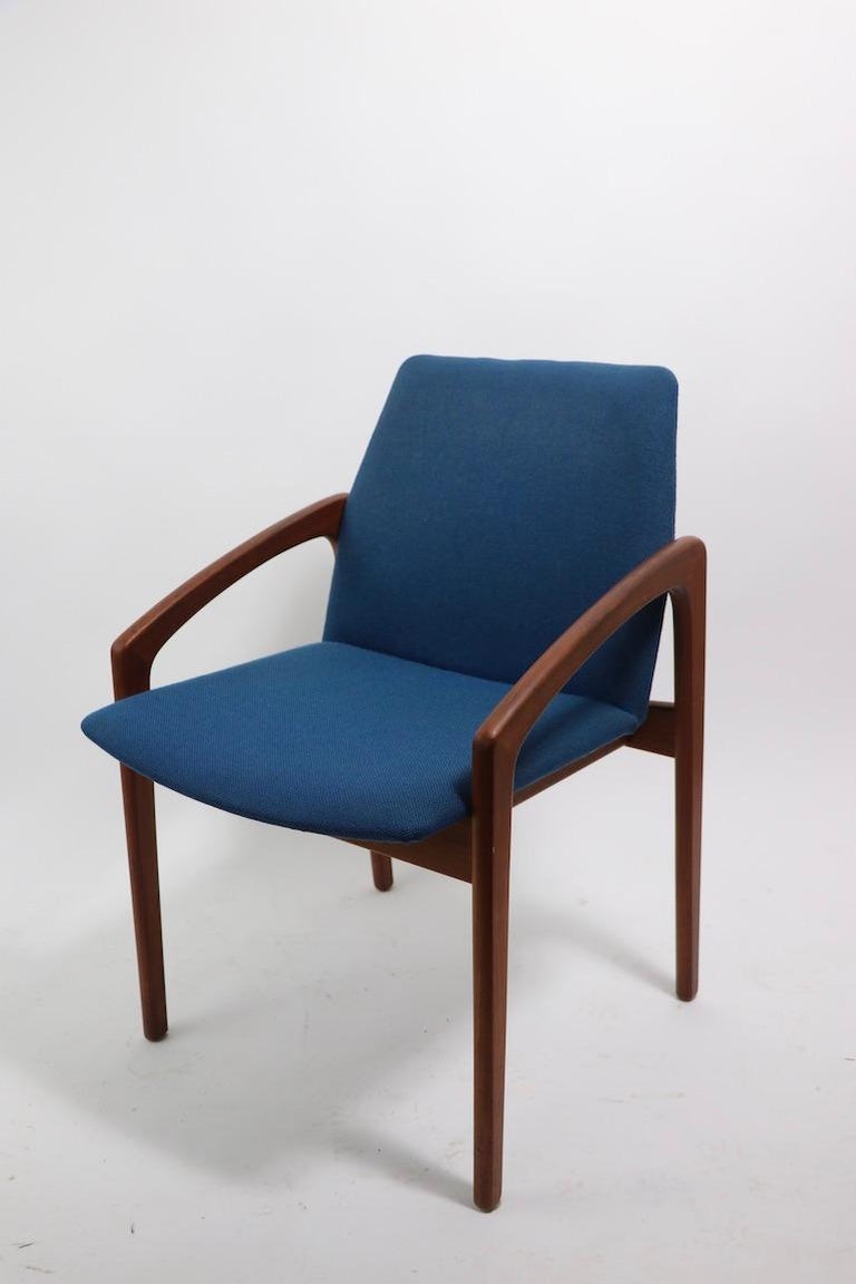 Chic architectural set of 6 Danish Mid-Century Modern dining chairs, designed by Henning Kjaernaulf for Korup Stolefabrik. Solid teak dark stained frames, and original blue tweed upholstered fabric seats and backs. All are in very good original