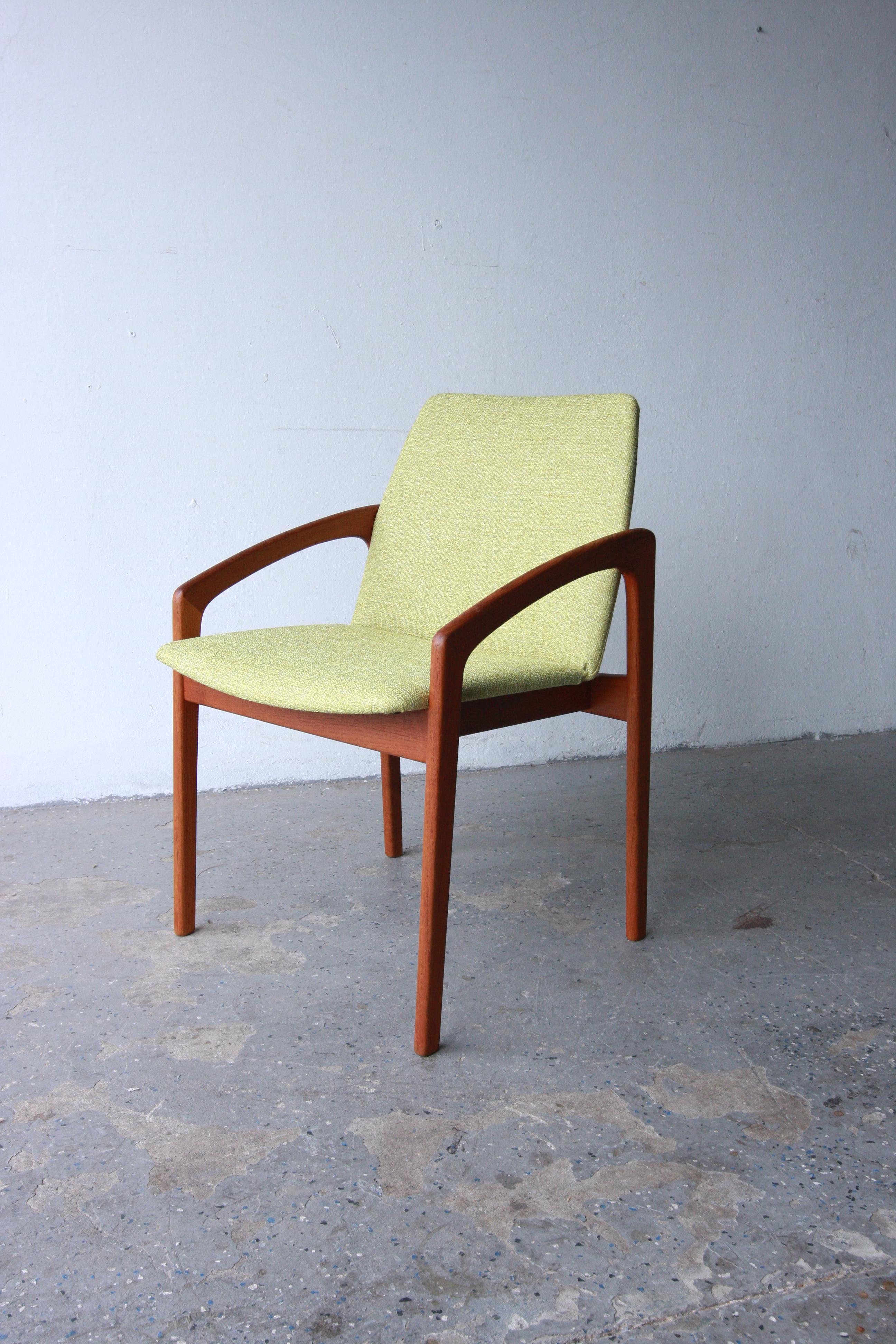 Collection of six Danish Modern  dining chairs, featuring solid teak continuous arms and legs, along with Newly upholstered seats and backs. Designed by Henning Kjaernulf for Korup Stolefabrik 

Chairs have been refinished and restored. And have