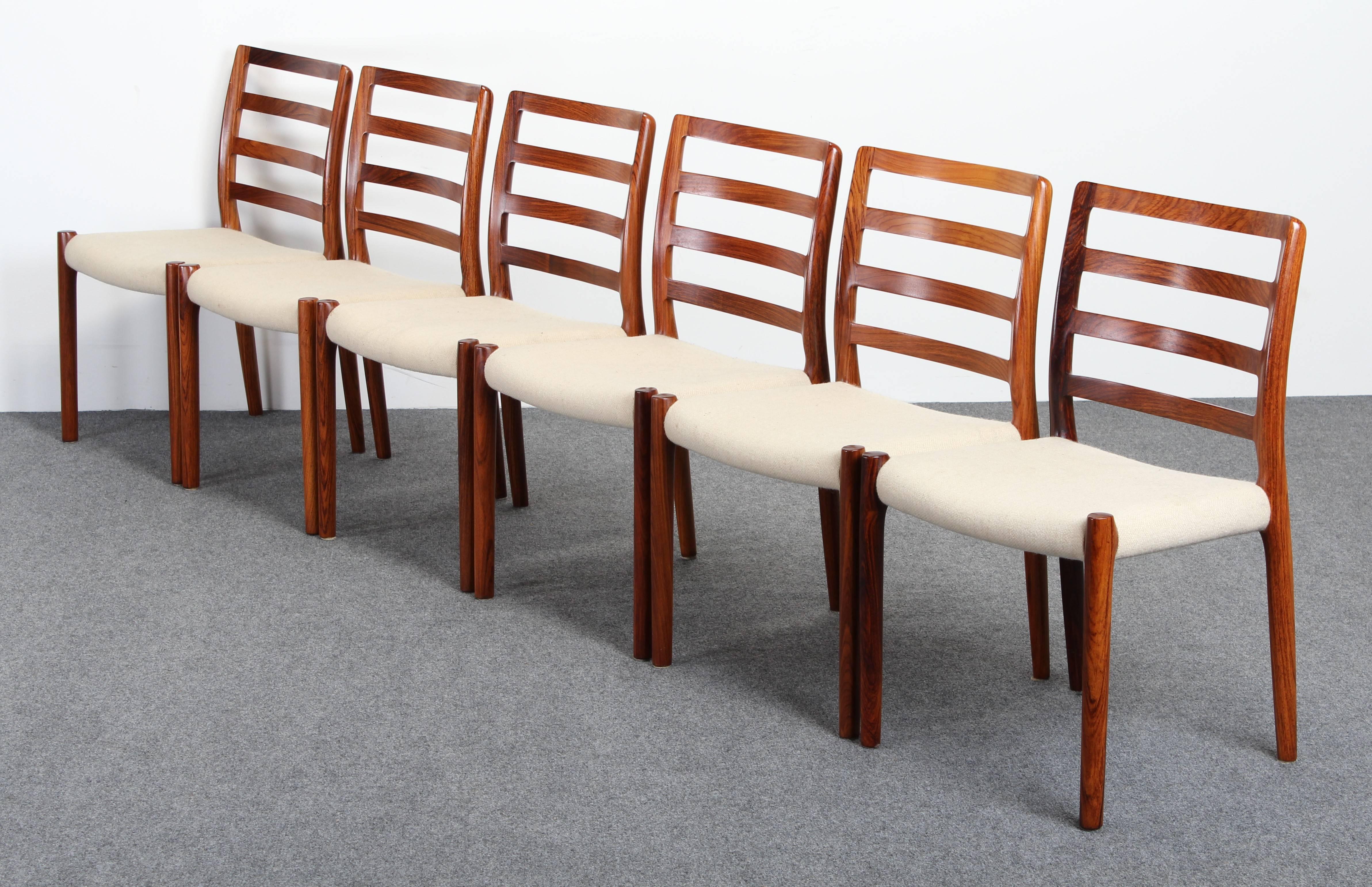 A well crafted set of six Danish rosewood Niels O. Moller chairs, No 85. These are the most sturdy and strongest built Danish chairs available. Stamped J. L. Moller Models Made in Denmark on bottom of chairs. Re-upholstery required. Seat height 18