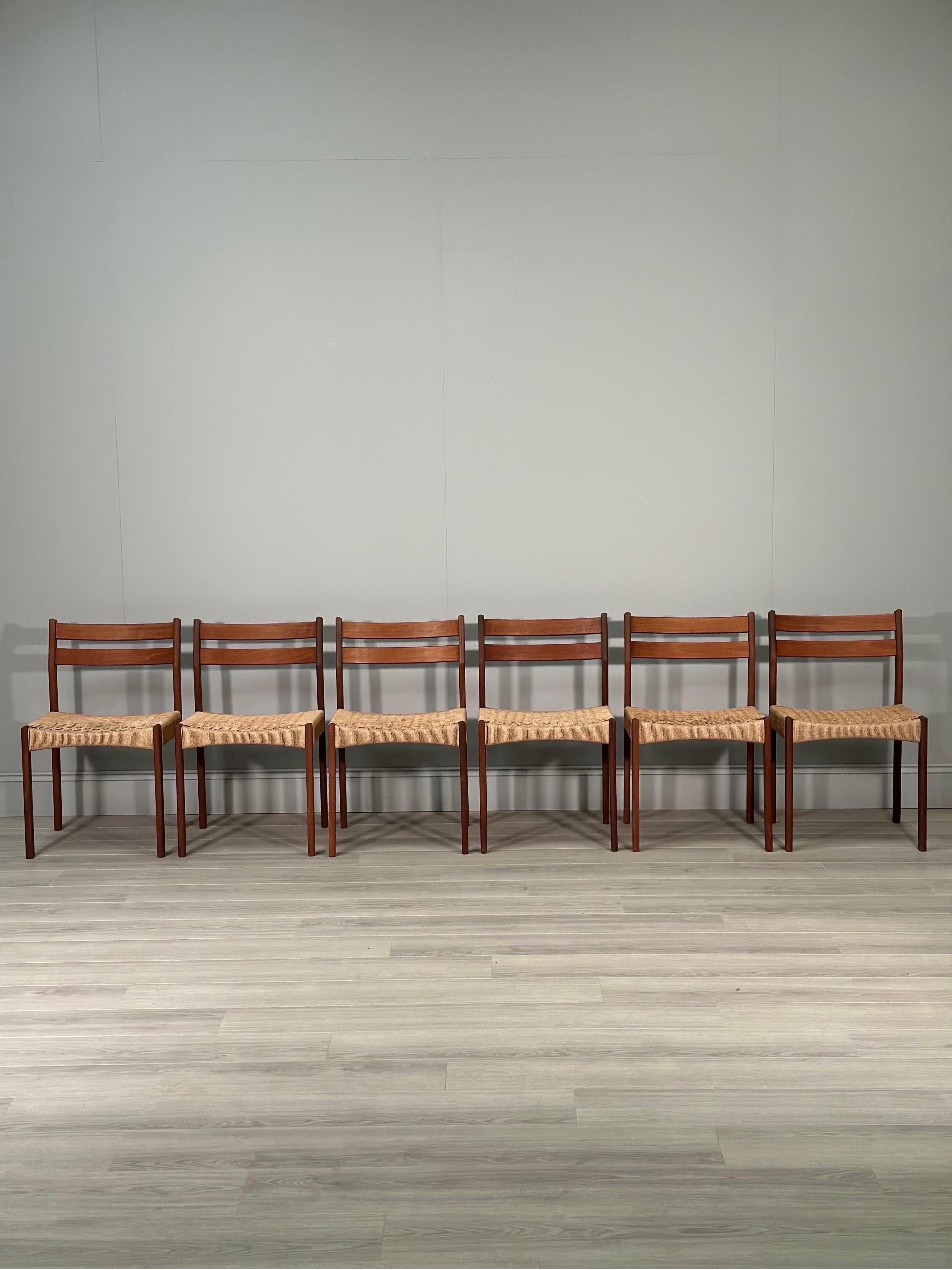 A set of six Danish teak and paper cord dining chairs designed by Arne Hovmand Olsen for Mogens Kold dating to the 1960s. An iconic set of chairs with a curved teak back and original paper cord seats, all of which are in fantastic original