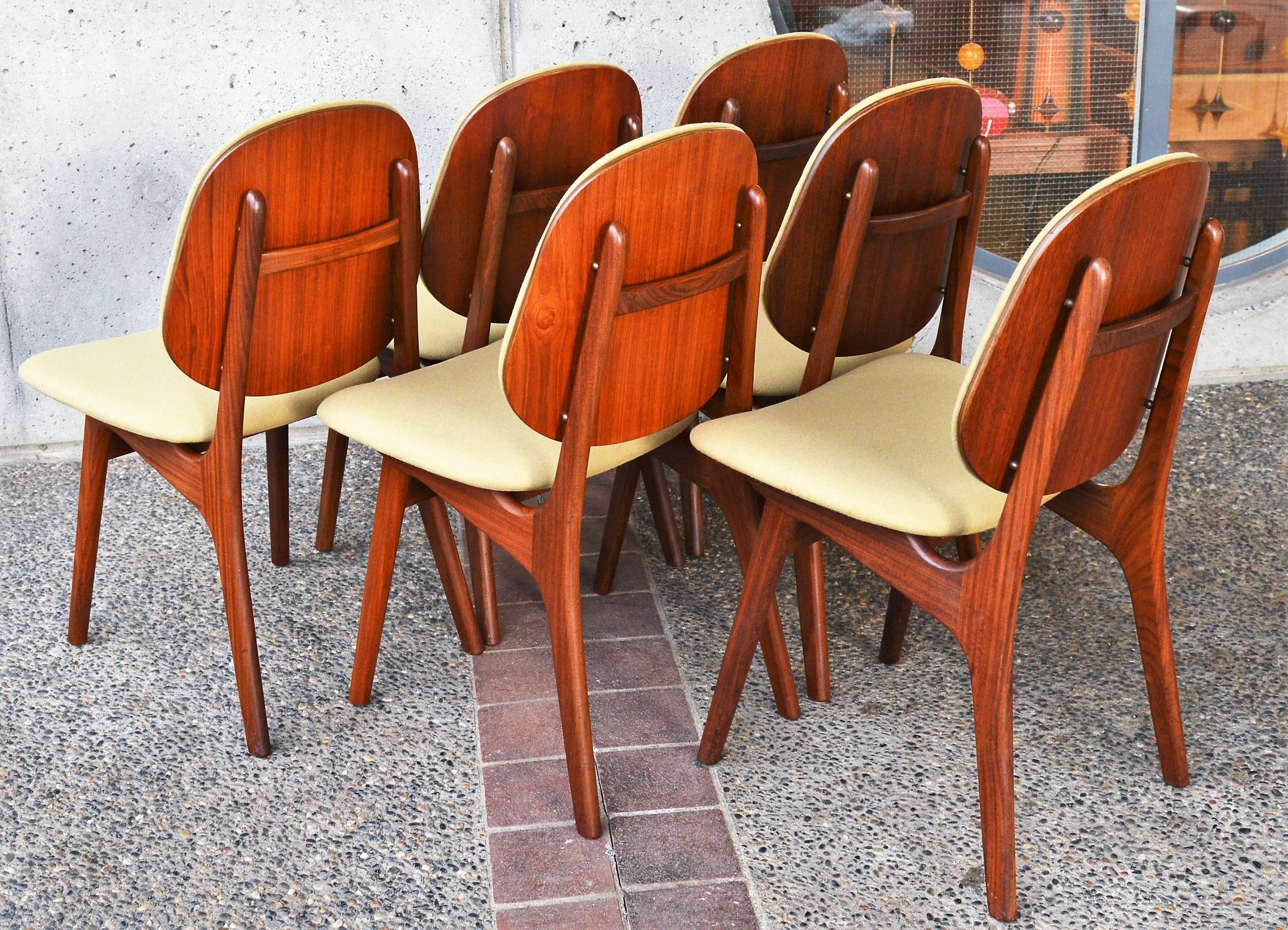 Totally gorgeous set of six Danish modern teak dining chairs designed by Arne Hovmand-Olsen in the 1960s. They have been reglued, freshly oiled and reupholstered with new foam and a quality camel felted wool. I love the wood 