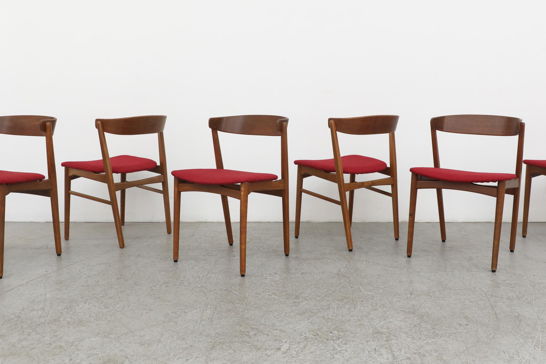 Stunning set of 6 Henning Kjærnulf teak dining chairs with swooping curved backrest and newer red upholstered seating. In original condition with visible patina and wear, consistent with their age and use. Other similar sets of dining chairs with