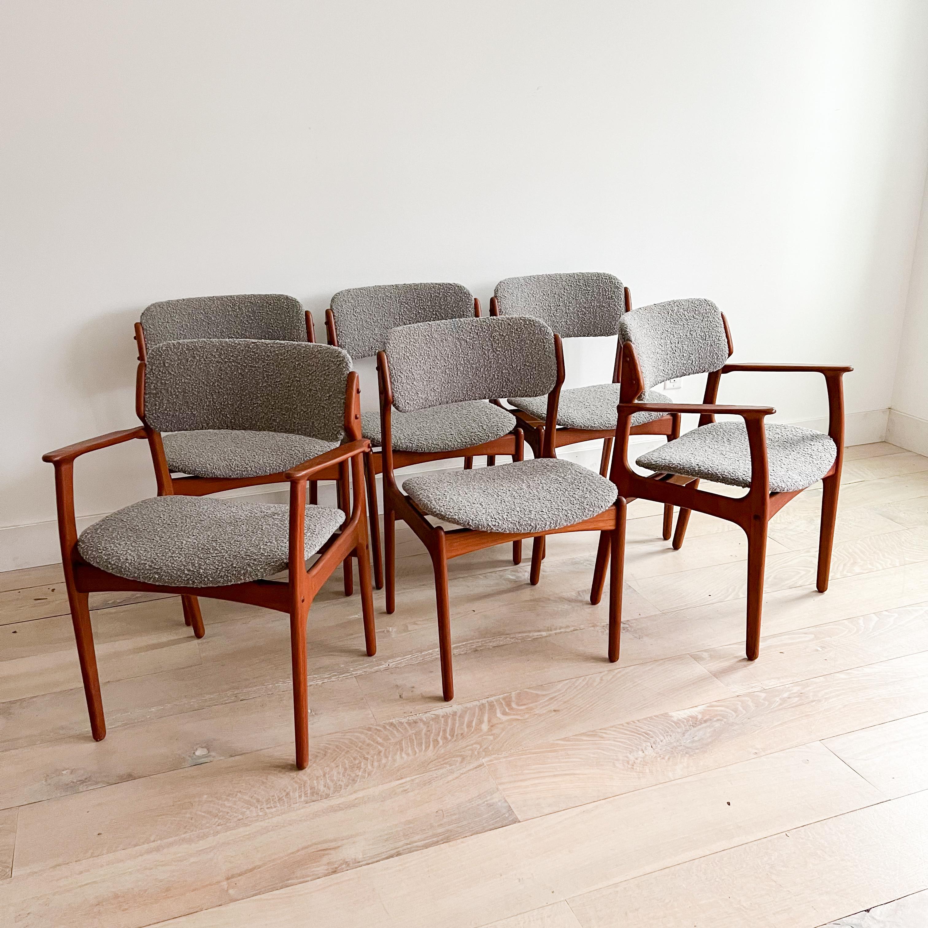 Set of 6 mid century modern danish teak “floating seat” dining chairs by Erik Buch. New light grey boucle upholstery. Some light scuffing/scratching from age appropriate wear to the teak frames. 

Armchairs - 23.75”x18.5” 17.5”SH 31.5”H

Armless