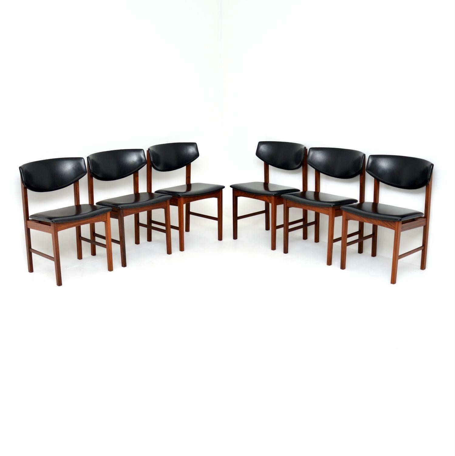 A fantastic set of six danish dining chairs in solid wood. These were made in Denmark, they date from the 1960’s.

They are of amazing quality and are extremely comfortable. They seats and backs are upholstered in black vinyl which is well padded.