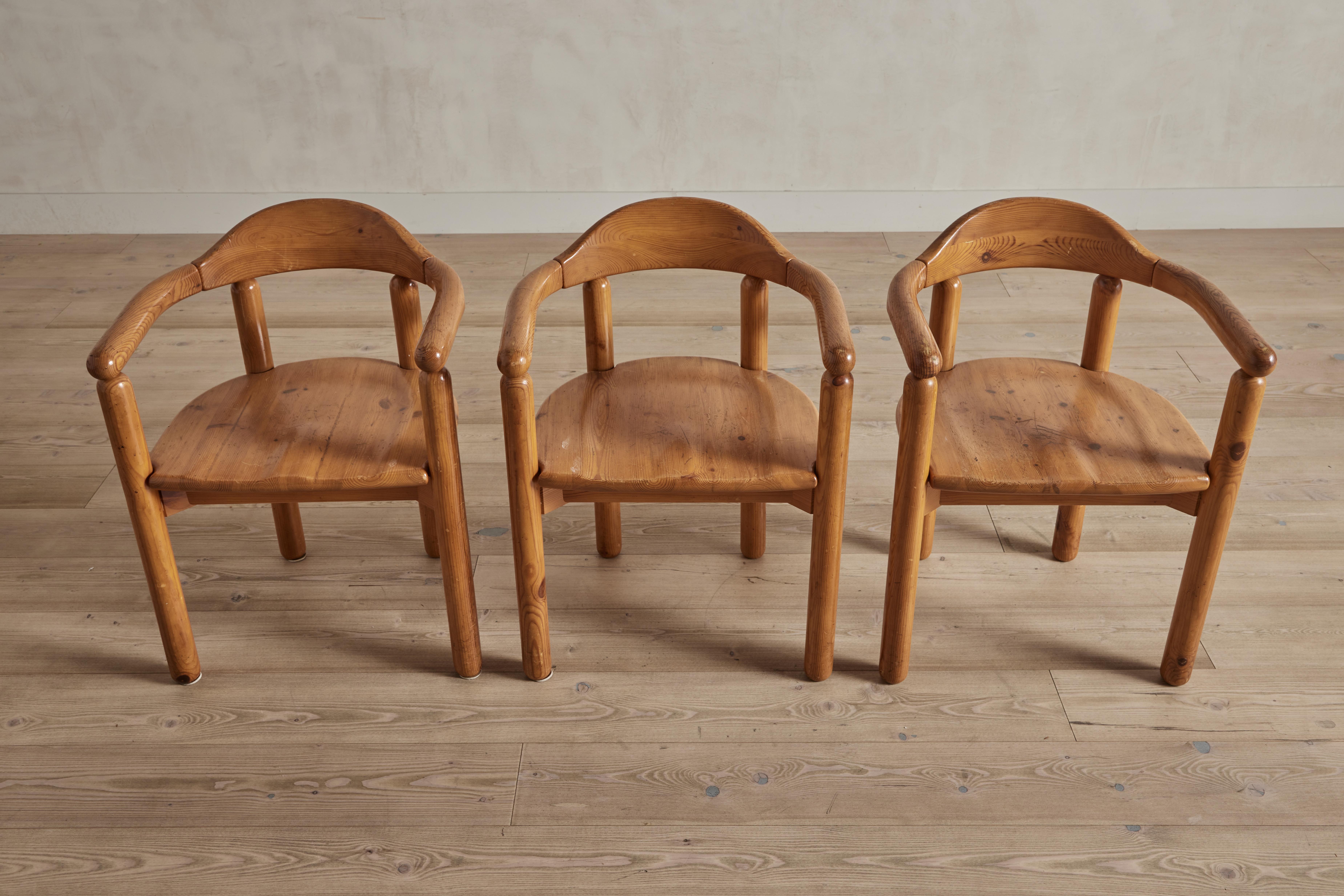 Set of 6 Rainer Daumiller pine wood dining chairs with armrests. Made in Denmark circa 1970. Some visible wear on wood that is consistent with age and use.