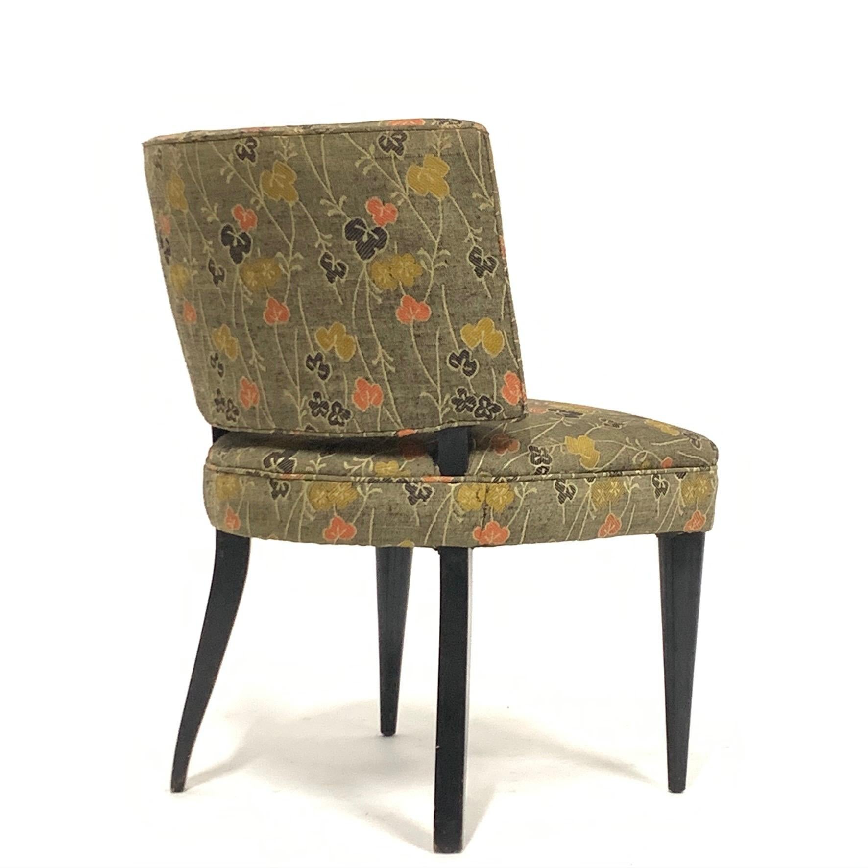 A generously proportioned set of six Gilbert Rohde for Herman Miller from the Paldao group with ebonized solid wood legs. The chairs are covered in a vintage silk fabric with an Asian motif that is serviceable. These chairs are fairly uncommon and