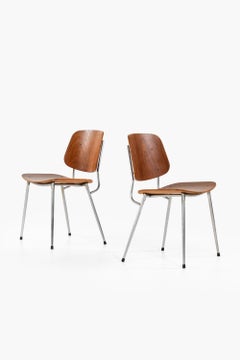 Set of 6 Dining Chairs and 2 Armchairs in Teak with Steel by Børge Mogensen