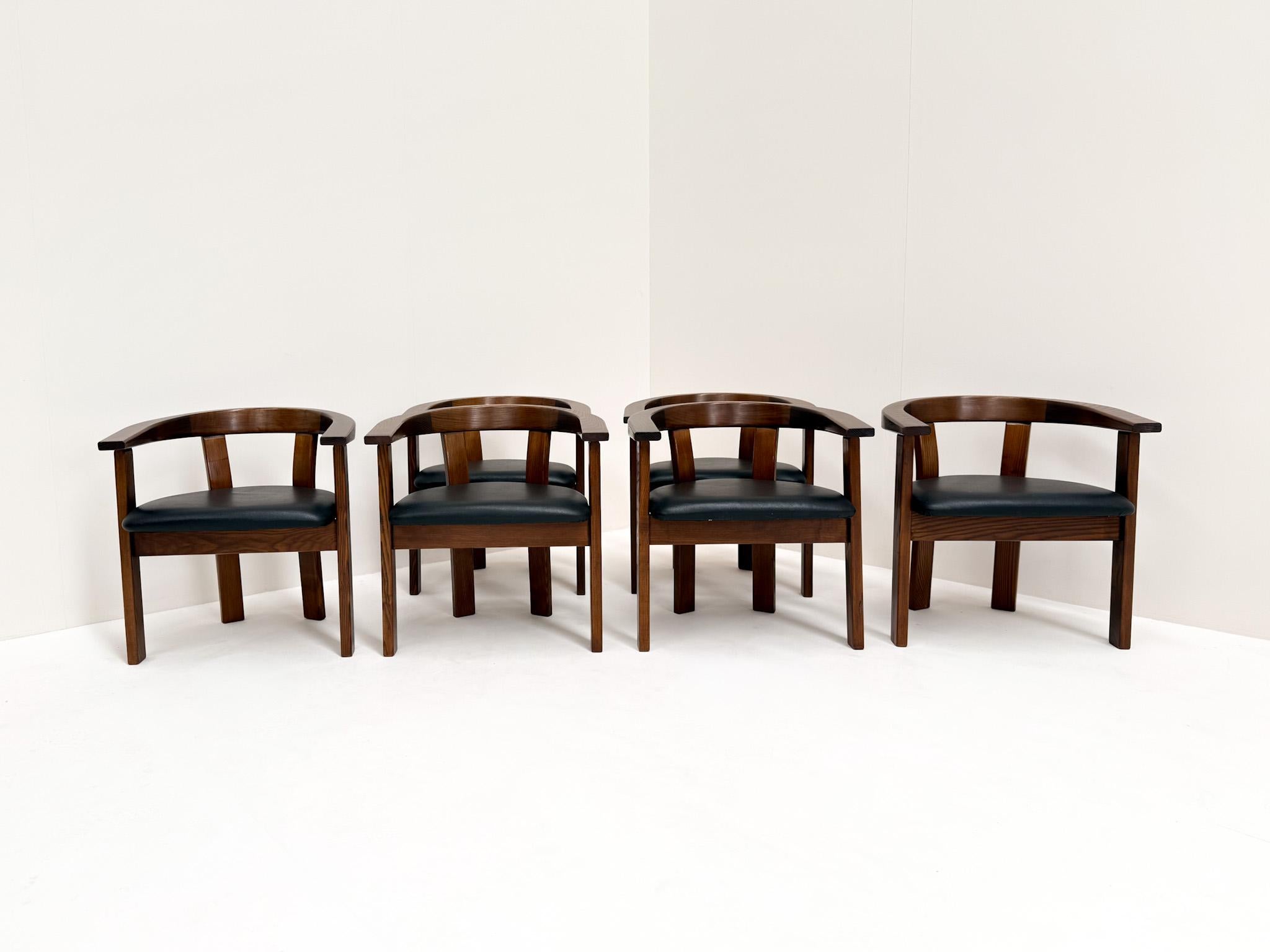 Set of six Danish dining chairs, labeled Lars Gangsø – Made in Denmark, dating from the 1970s. Each chair features a sculptural curved backrest that flows seamlessly into the arm supports, creating both a striking silhouette and comfortable seating.