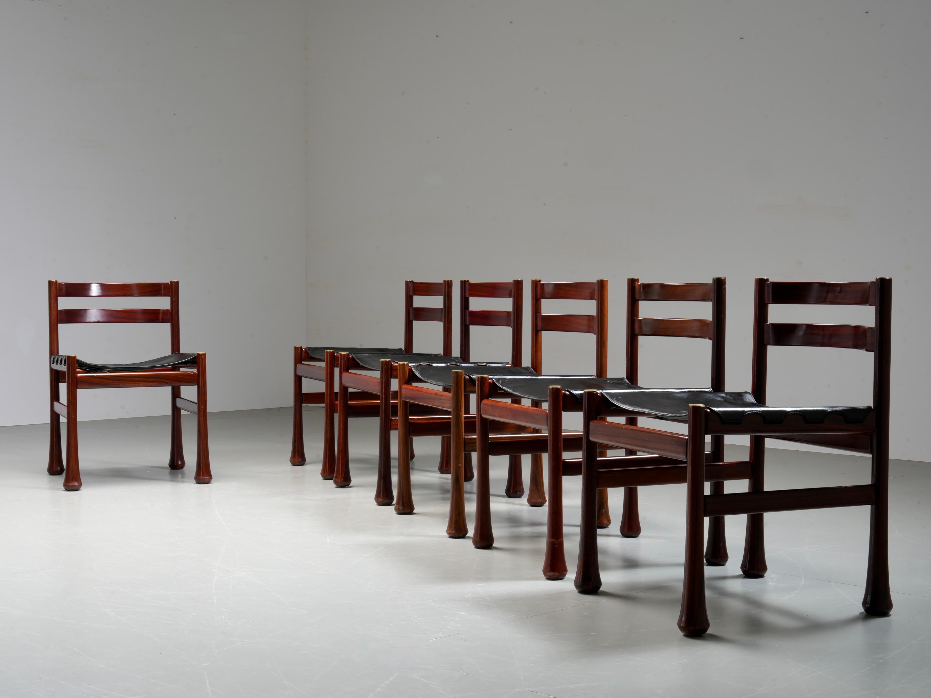 Set of 6 Dining Chairs by Luciano Frigerio in Wood and Leather, Italy, 1970's

Set of six sculptural dining chairs by Luciano Frigerio, Italy, 1970's. Made of solid wood with flared legs and stretched leather seats. The design plays with weight and
