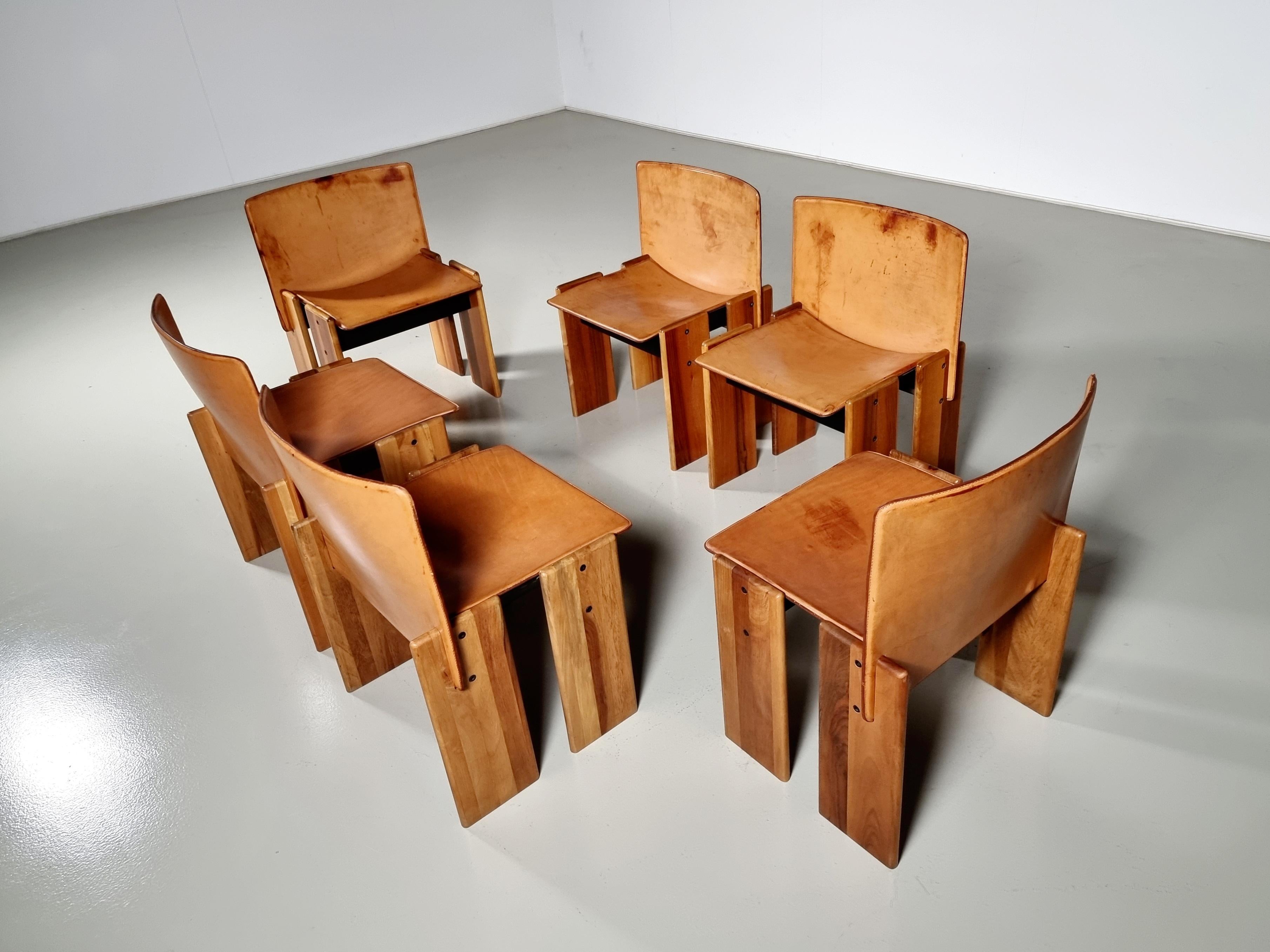 Solid Walnut and leather dining chairs, Sapporo, Mobil Girgi, 1970s

The deep cognac leather shows a beautiful patina and forms a striking combination with the walnut wood. Interesting is the 'flat' shape of this chair where the designer has chosen
