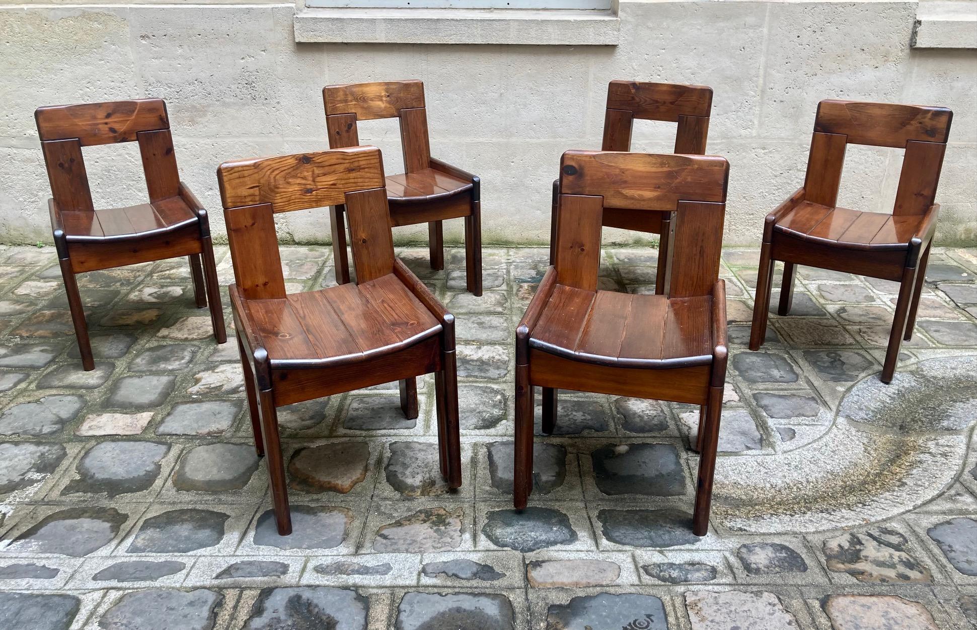 A set of 6 dining chairs by Silvio Coppola ( 1920 -1986) for Fratelli Montina. 
Stained pine wood, rich patina with nice glow. 
Constructivist design with brutalist approach. 
Italy, circa 1970

Dimensions : 
Height : 77 cm / 30,3 inch
Width