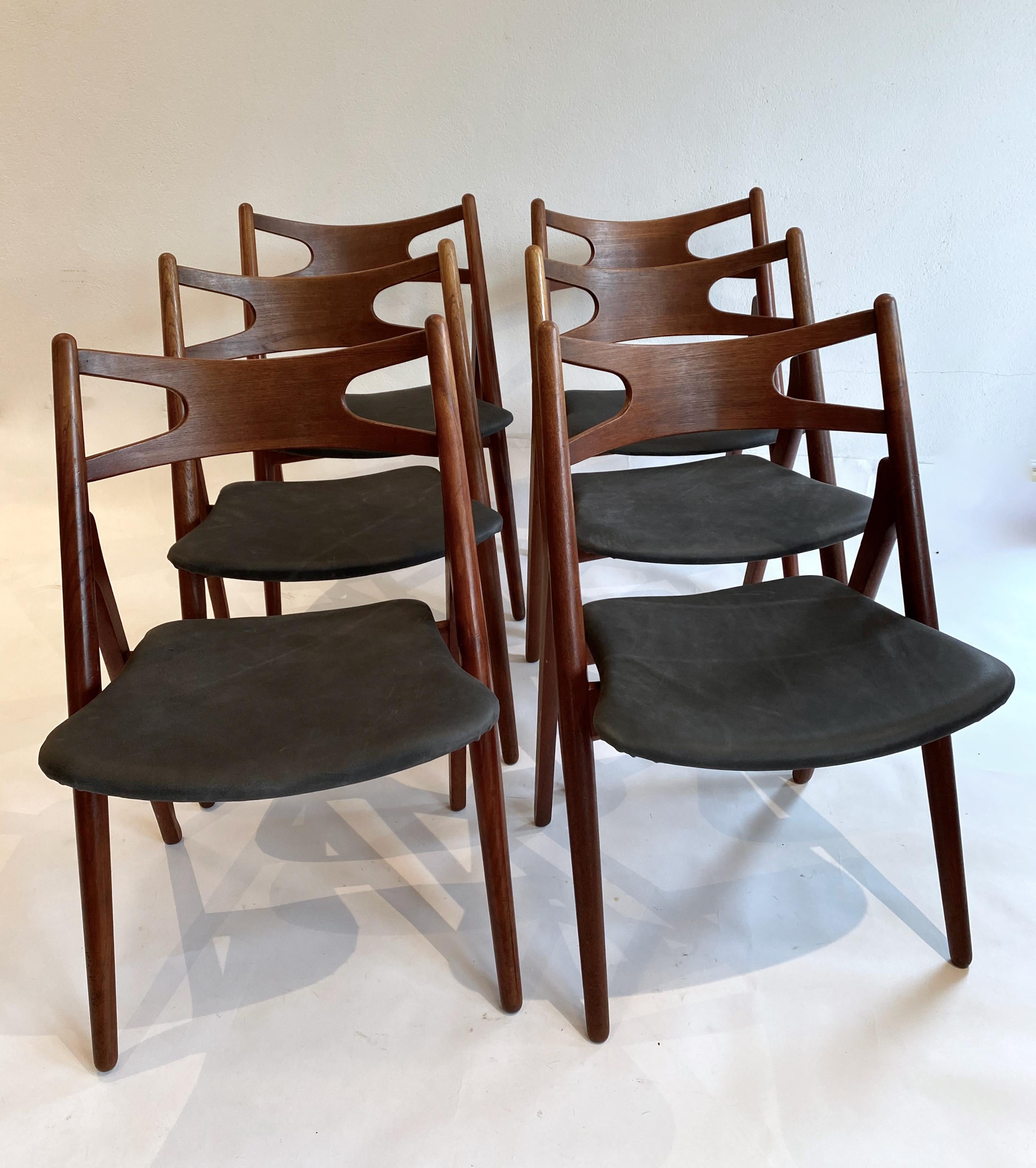 Set of 6 dining chairs, model CH-29, also called Sawhorse chair. Designed in 1952 by Hans Wegner and manufactured by Carl Hansen in Odense, Denmark. Early set from the 50`s totally in massive teak which is highly unusual.
All chairs newly