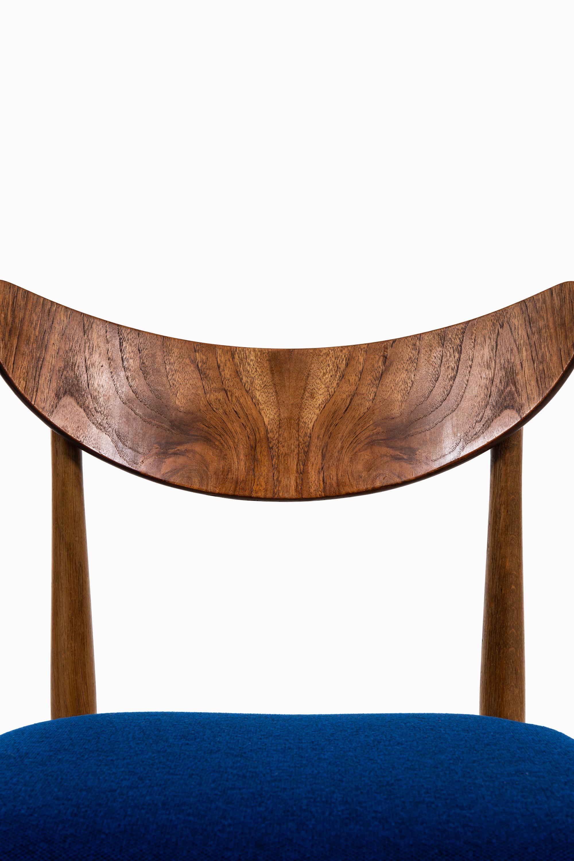 Scandinavian Modern Set of Six Dining Chairs in Oak, Teak and Blue Fabric Produced in Denmark For Sale