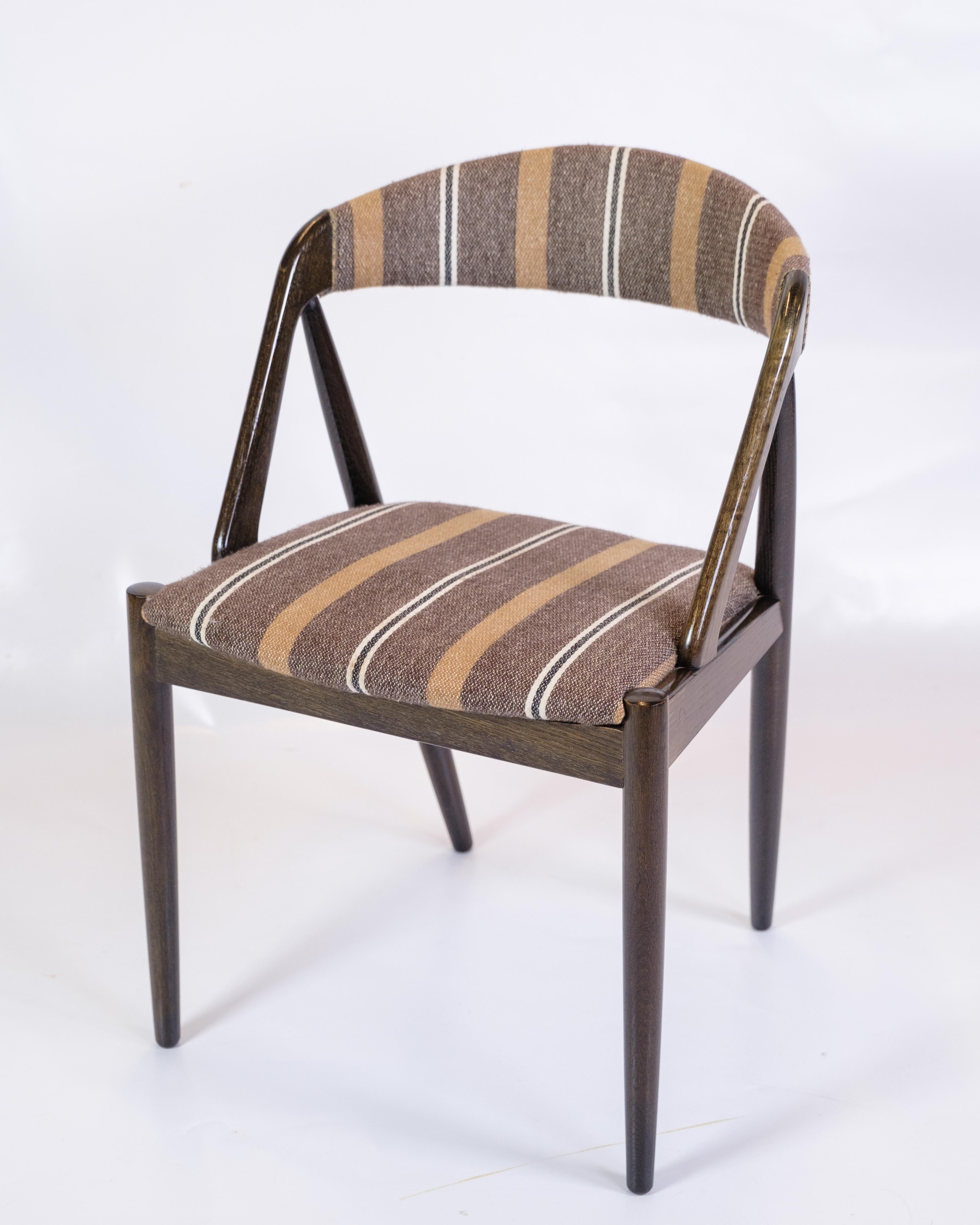 Mid-Century Modern Ensemble de 6 chaises de salle à manger modèle 31 fabriquées en bois foncé par Kai Kristiansen des années 1960 en vente