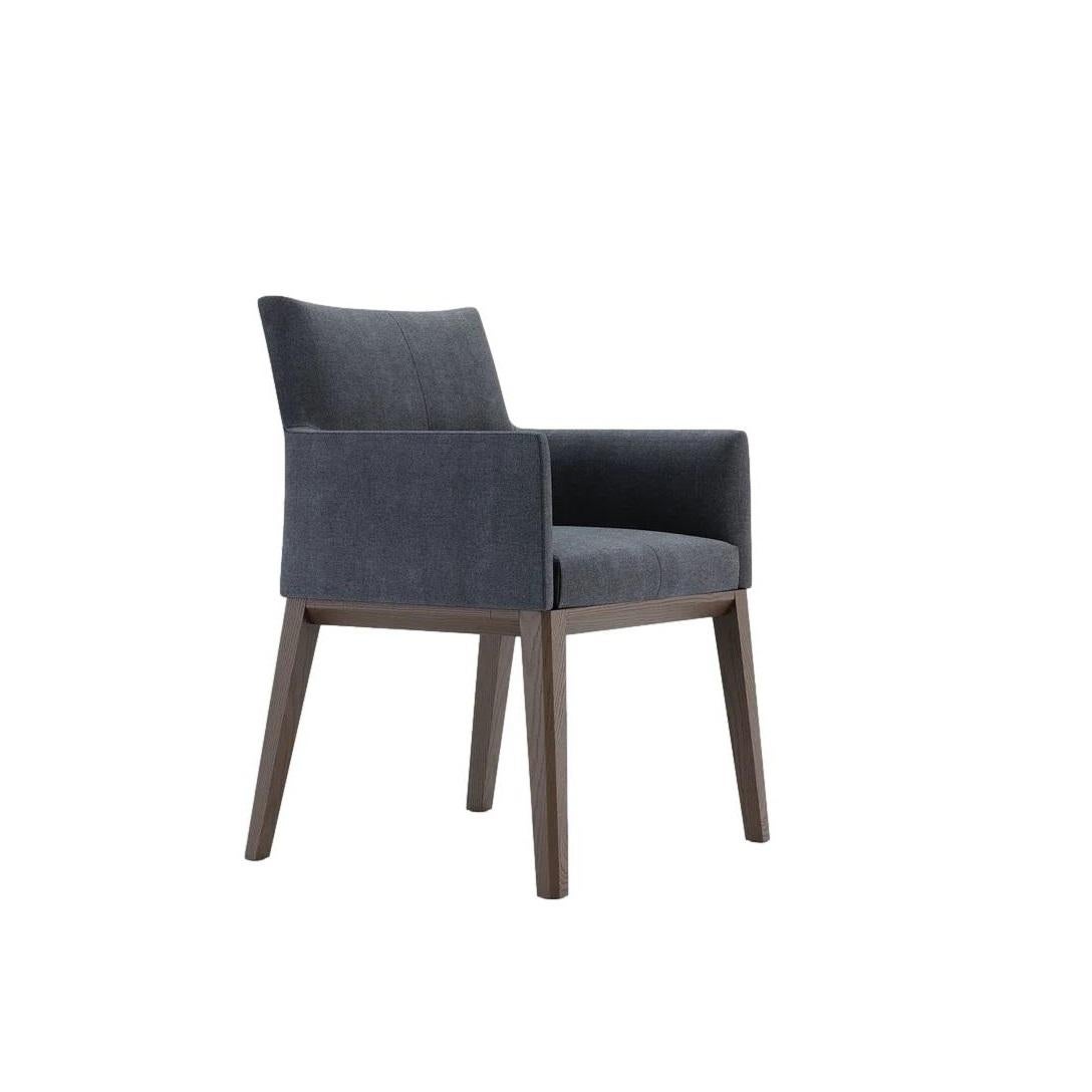 This Dining Chair showcases a harmonious blend of traditional and contemporary design, evident in its balanced form. Crafted with a solid wood structure and a comfortable seat cushion, the chair features exquisite double-top stitching across the
