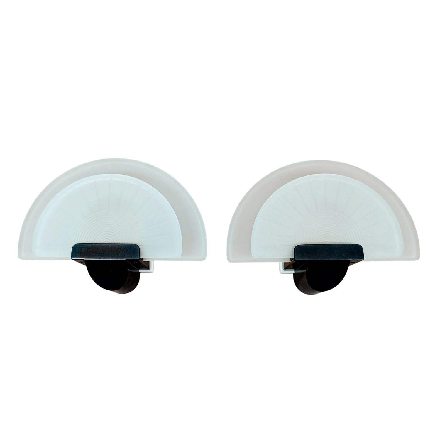 Set of 6 wall lights in lacquered steel and thick, fan-shaped pressed glass.

Model: Diva

Design: Ezio Didone for Arteluce,

Italy circa 1980