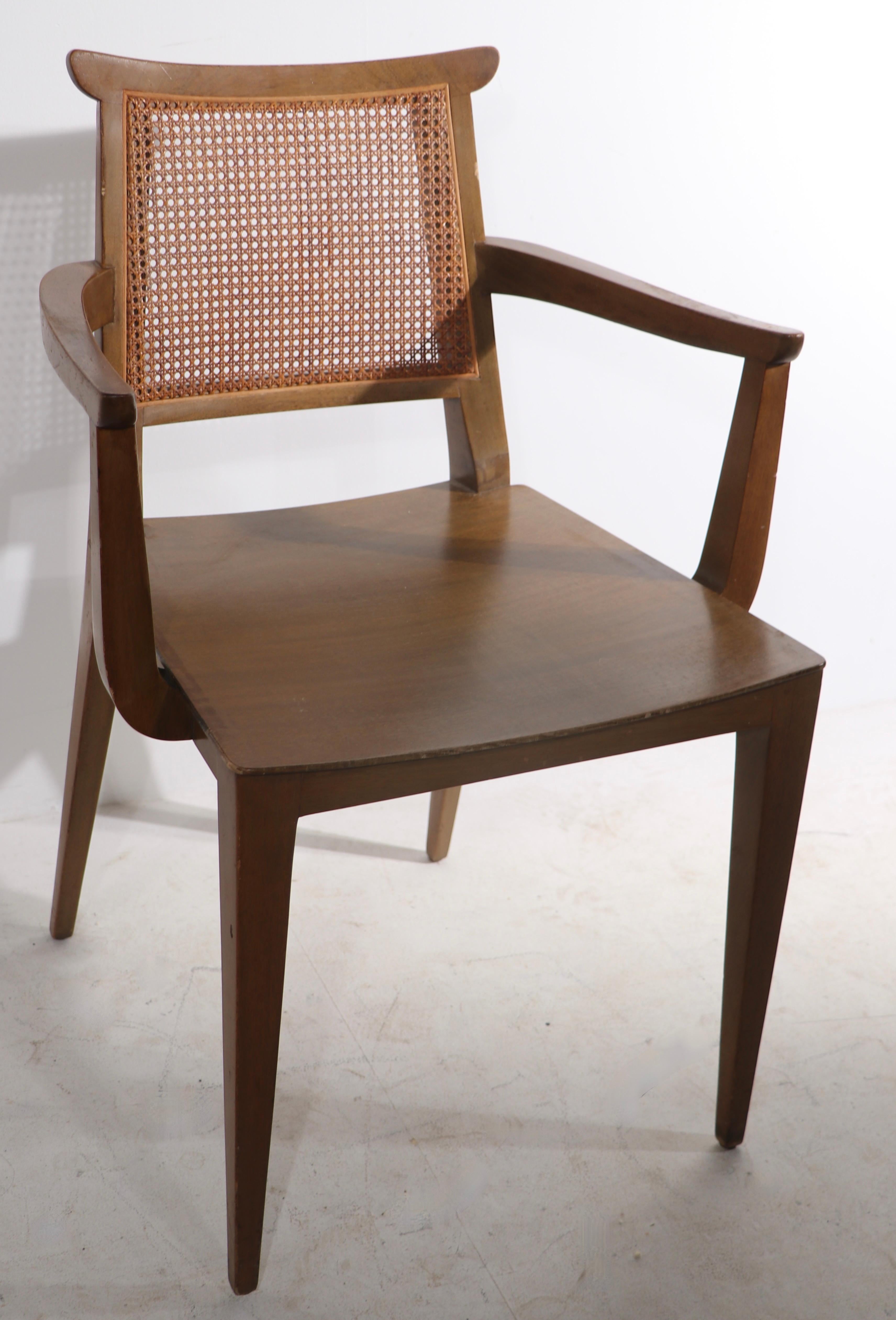Rare set of dining chairs, designed by Edward Wormley for Dunbar, circa 1940/1950's. The chairs feature mahogany frames, caned backs and three come with original leather seat pad. All six are structurally sound and sturdy, the canning is intact and