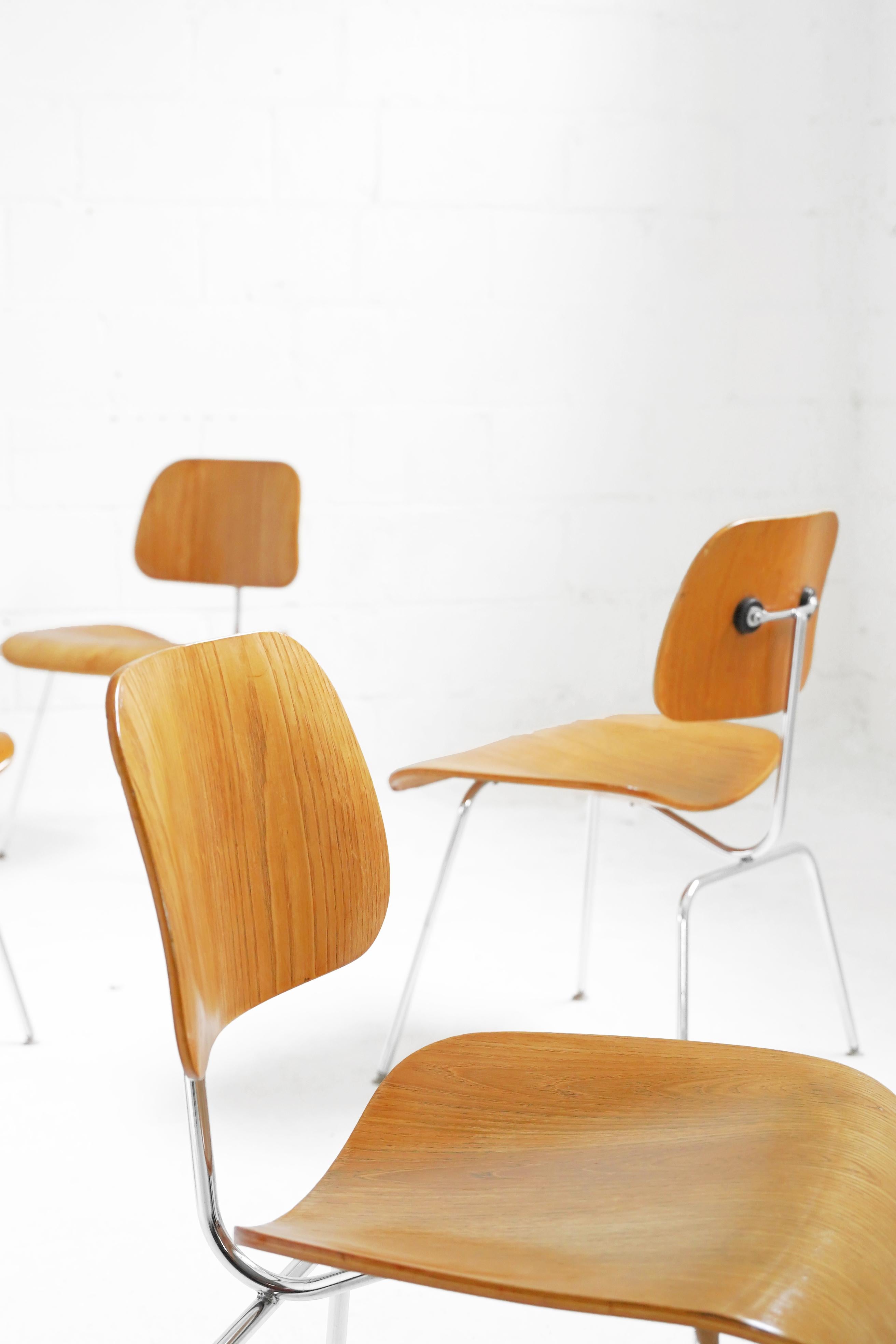 Stunning set of Eames DCM chairs for Herman Miller. Overall in good vintage condition with minor wear and chipping shown in photos. 4 Chairs have original glides on feet, 2 chairs have had them replaced. Chairs are 2001, 2002, 2009 Production. 6
