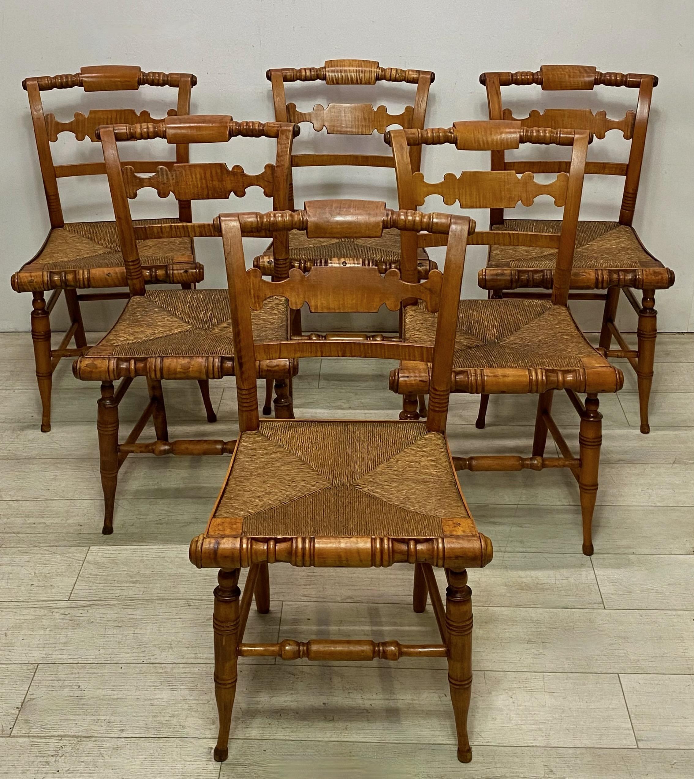 An unusually good set of six maple wood Hitchcock style chairs with rush seats.
In excellent original antique condition. Sturdy and Sound.
Recently refinished, likely original rush seats (one with a stain, please see photo).
American early 19th