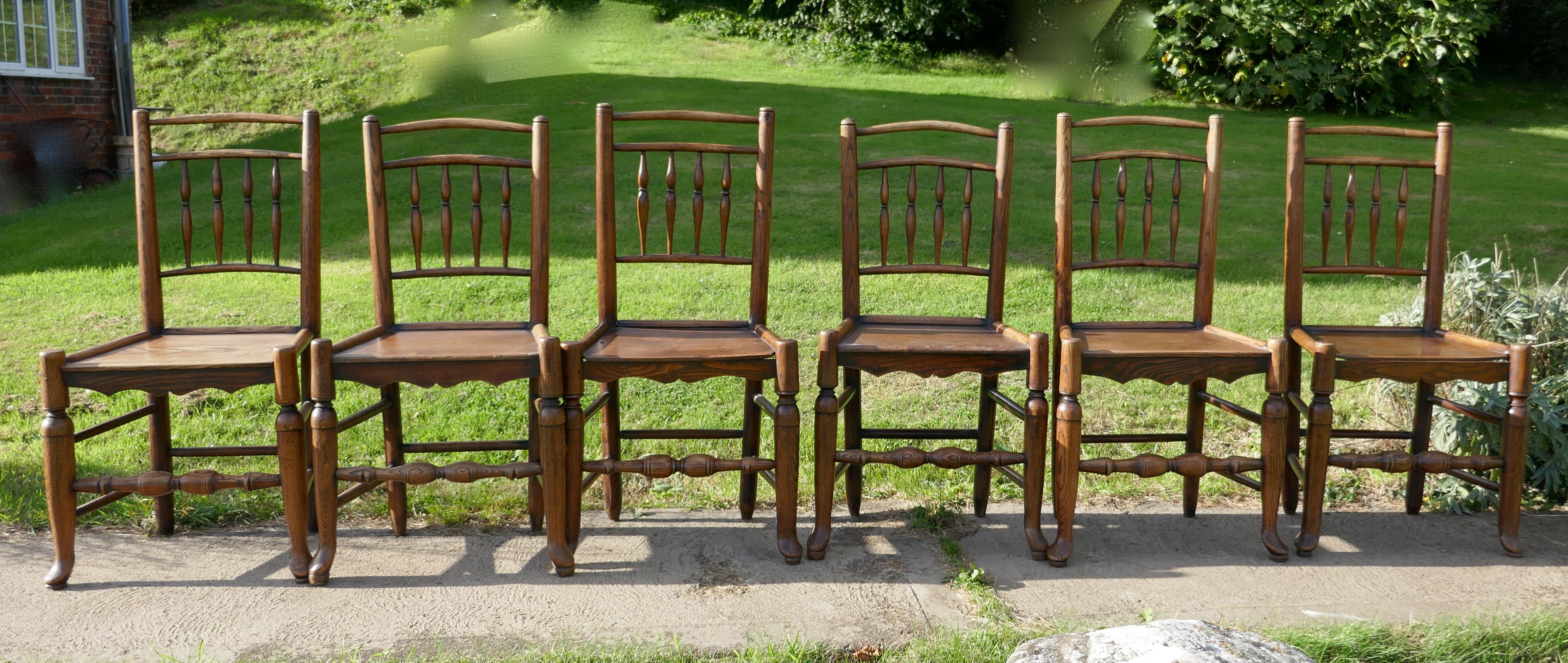 Set of 6 early 19th century elm and ash country chairs

This a great find, we have a set of these charming antique west midlands chairs, they all have elm plank seats and with spindled backs

The chairs are sound, some of them show signs of old
