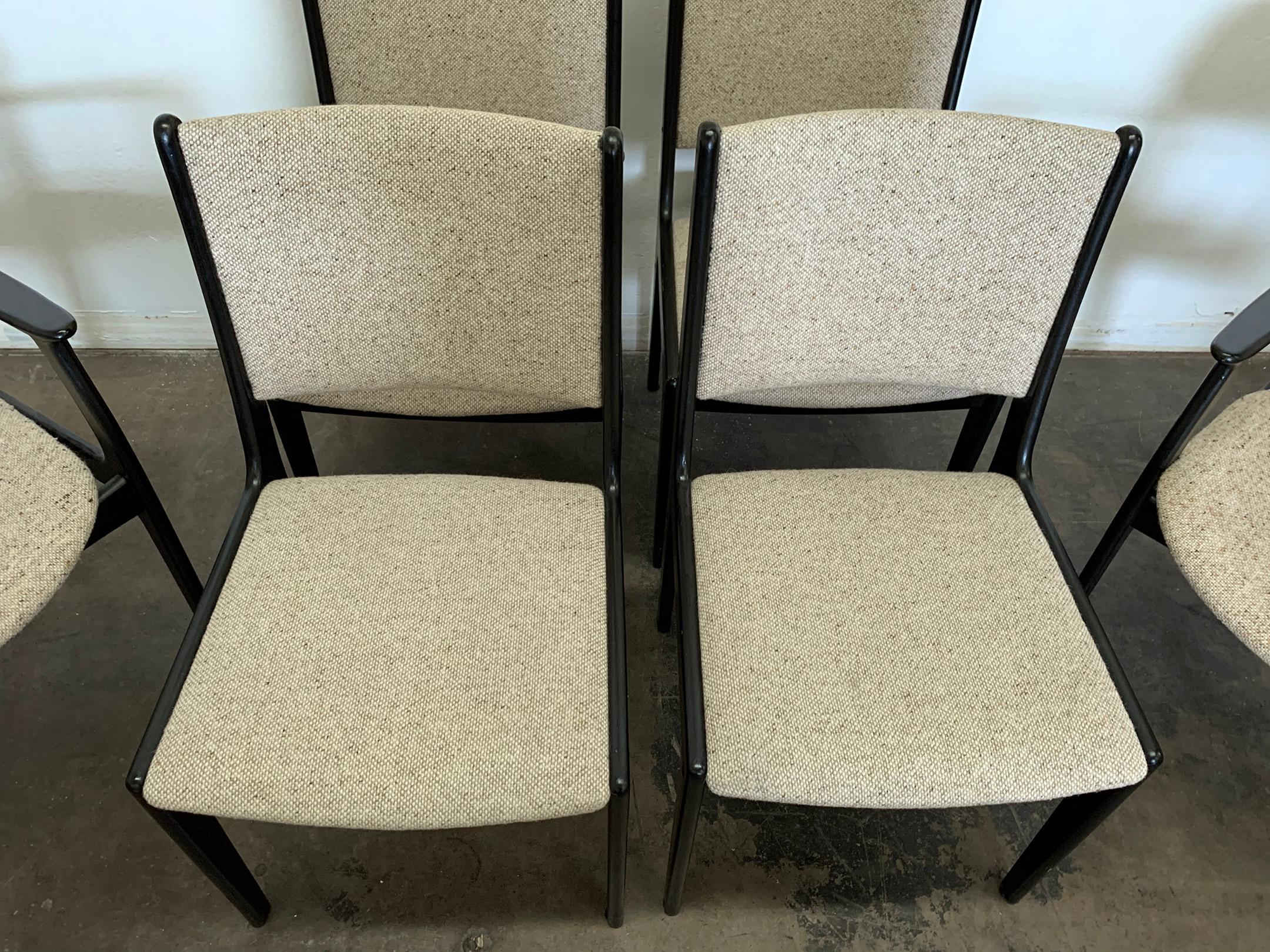 A wonderful set of 4 Erik Buch dining chairs with ebonized frames. Erik Buch's simple and clean Danish designs are timeless classics that never go out of style. These black, Danish modern chairs are effortlessly chic. We currently have them paired