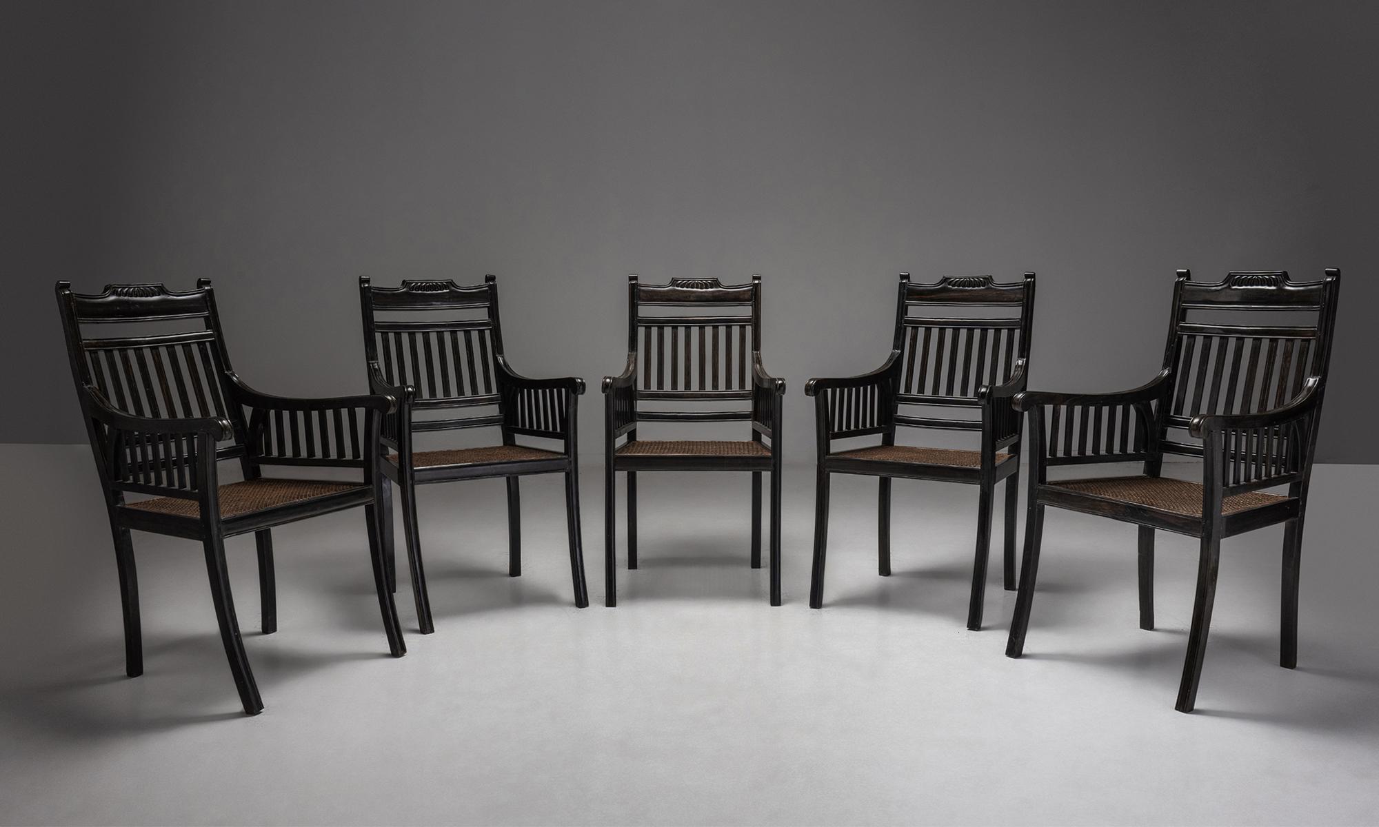 Set of (6) Ebony & Cane dining chairs

England 1940

Finely carved ebony framed with cane seats and out swept front legs.

Measures: 21.75” W x 24.25” D x 39.25” H.