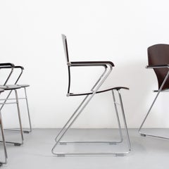 Set of 6 "Egoa" chairs with chromed steel frame and laminated wood seat and back