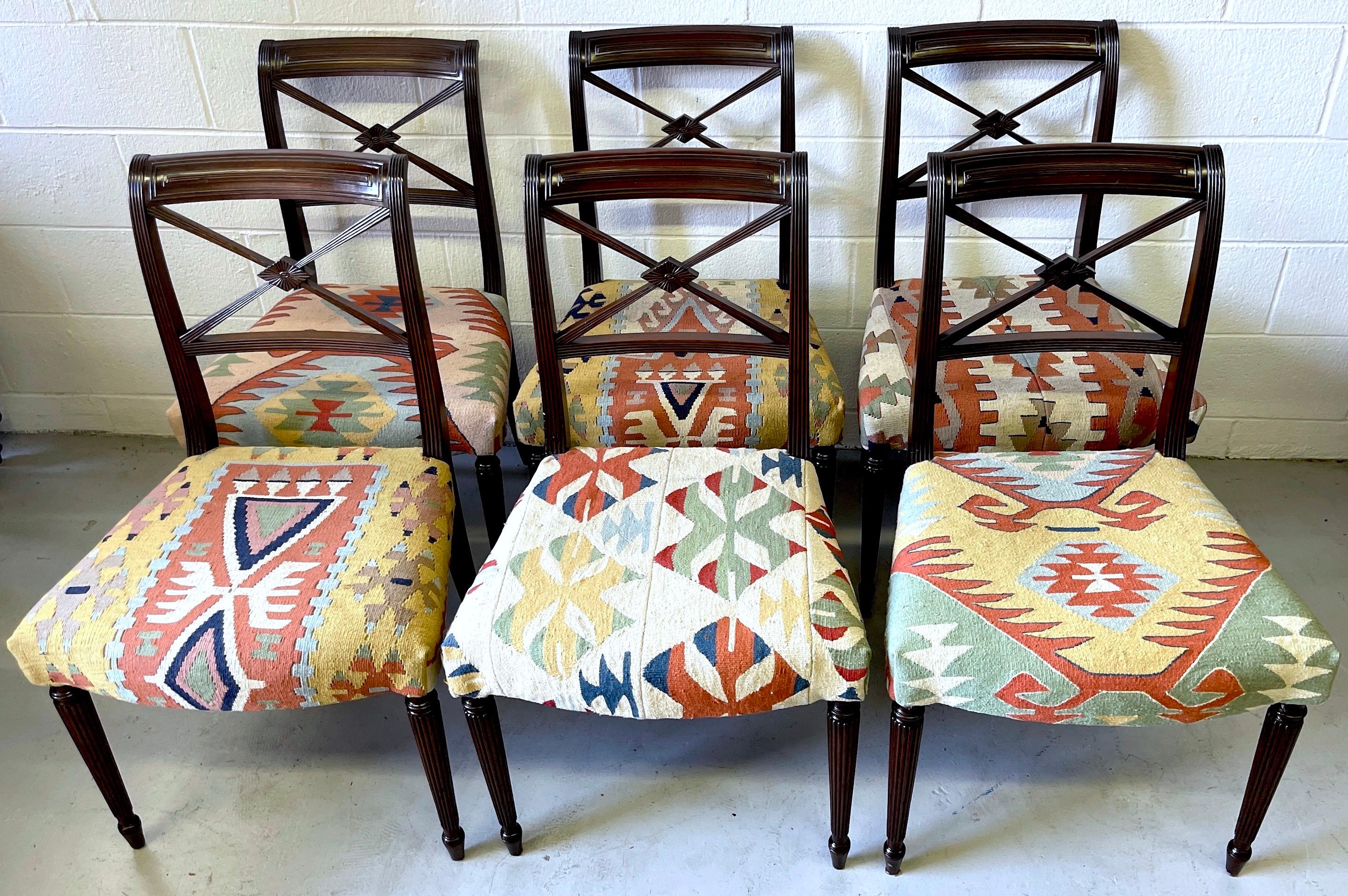 Set of 6 English Regency style carved mahogany & Kilim upholstered chairs 
England, Circa 1920s, the upholstery, Turkey, 1960s 

A rare find, a set of six well carved English Regency style chairs.
Each chair with a fine restrained Neoclassical