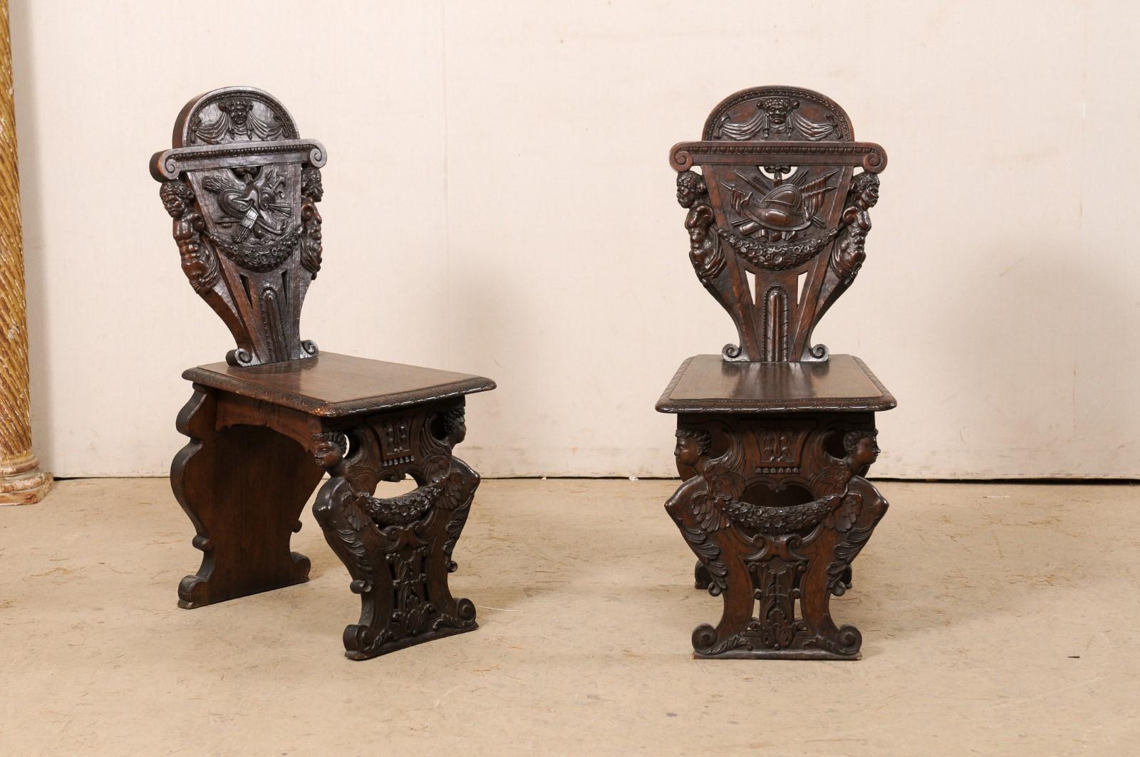 An English set of six Renaissance style elaborately carved hall chairs from the turn of the 19th and 20th century. This set of antique board chairs from England each have been ornately hand-carved in a series of grotesque figures, embellished with