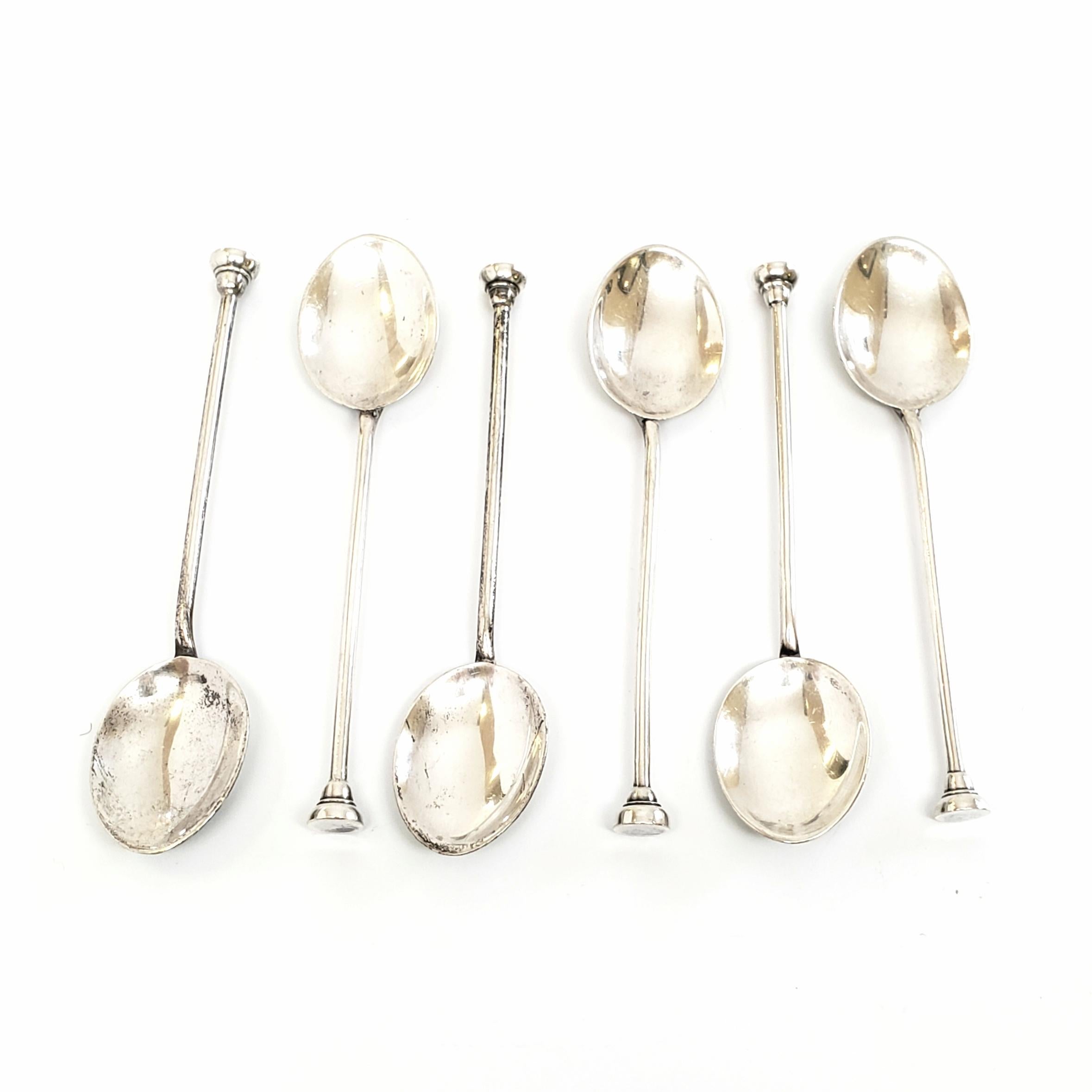 Set of 6 vintage sterling silver demitasse spoons by Henry Clifford Davis, Ltd.

Beautifully enameled, hand painted spoons with pink and purple flowers on the anterior of the bowls.

Measures 3 5/8