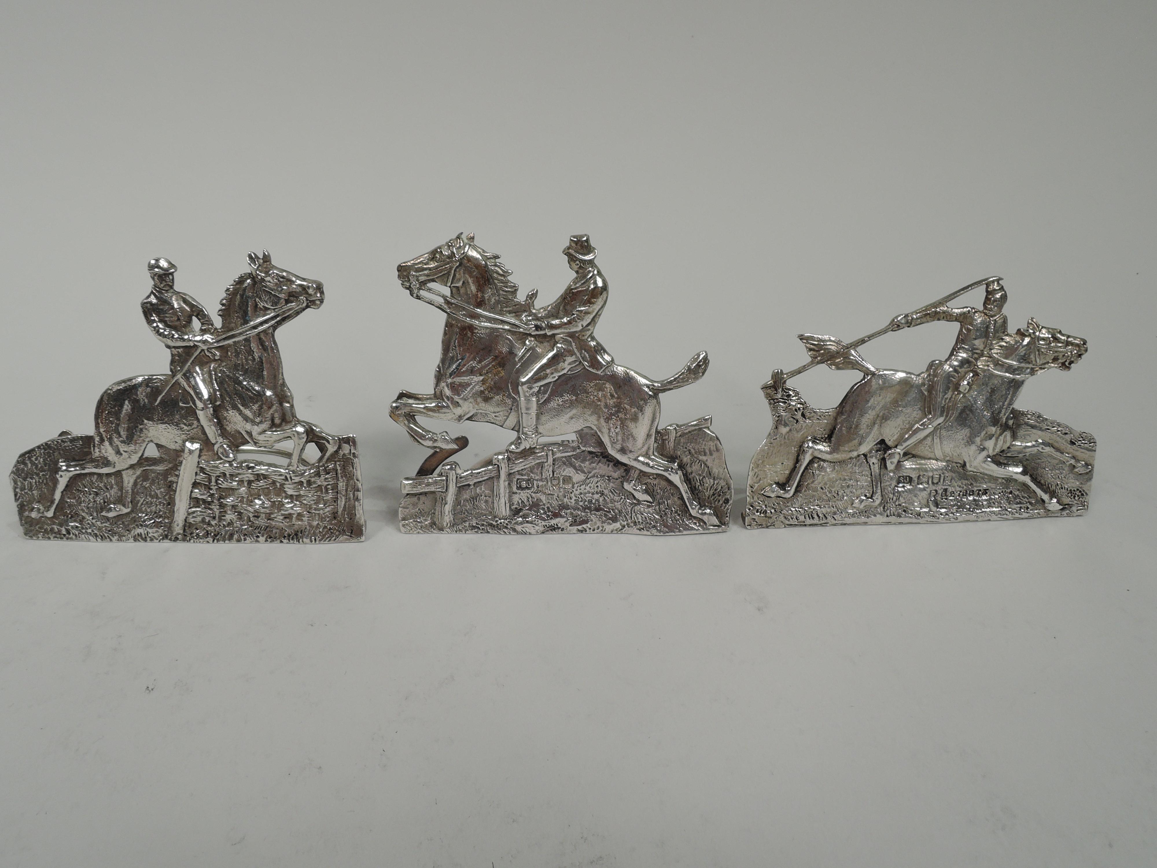 Set of 6 Victorian sterling silver equestrian place card holders. Made by Samuel Jacob in London, 1896-1902. Cut out with chasing, stippling, and tooling. Each different with jockeys, polo players, and hedge-jumping hunters. Hinged c-scroll