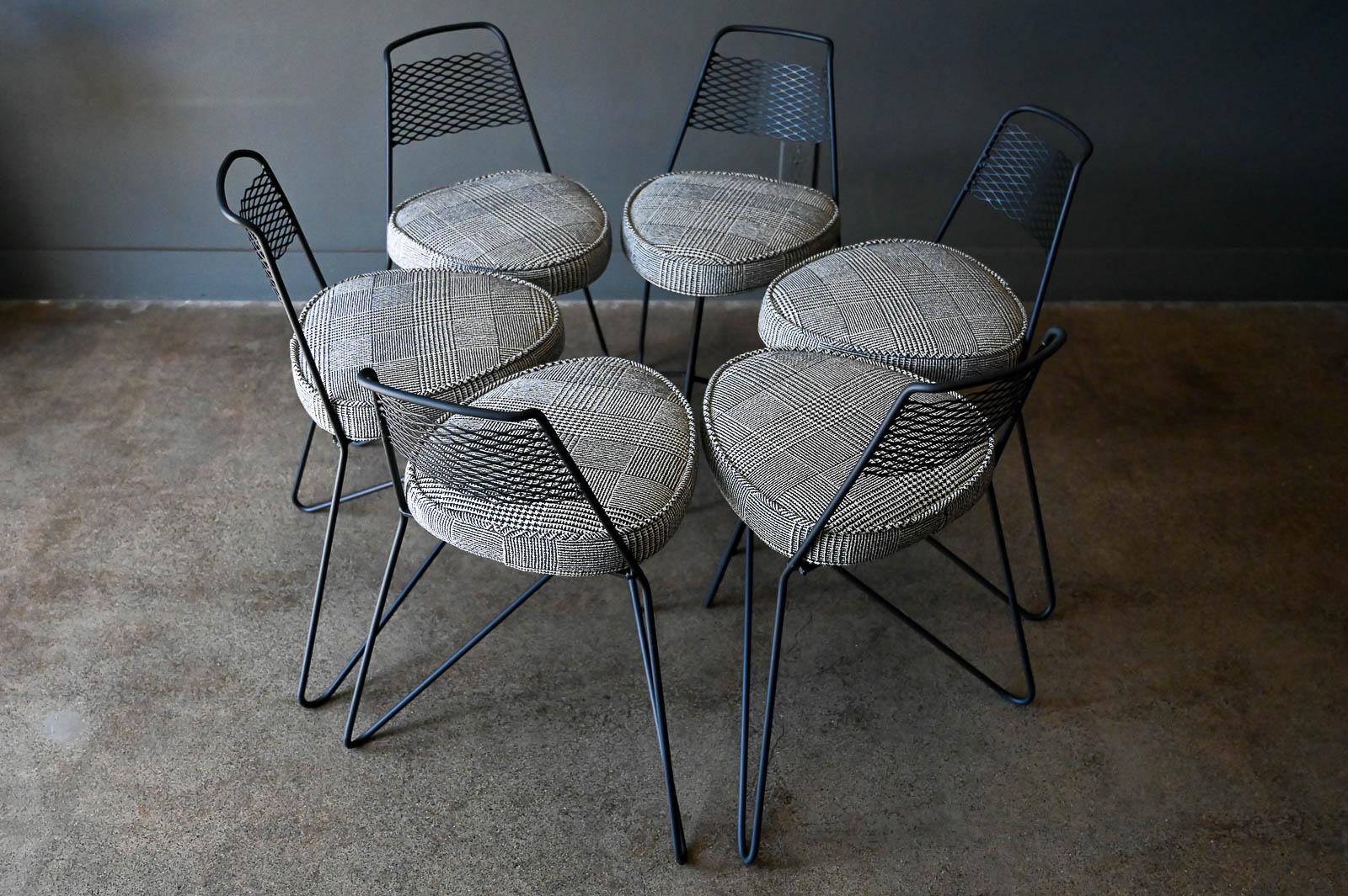 Set of 6 Expanded Metal and Iron Leg Dining Chairs, ca. 1960.  Professionally restored with new matte black powder coat and classic plaid indoor/outdoor fabric with new foam seats.  Perfect for an outdoor setting around a fire pit or table.  