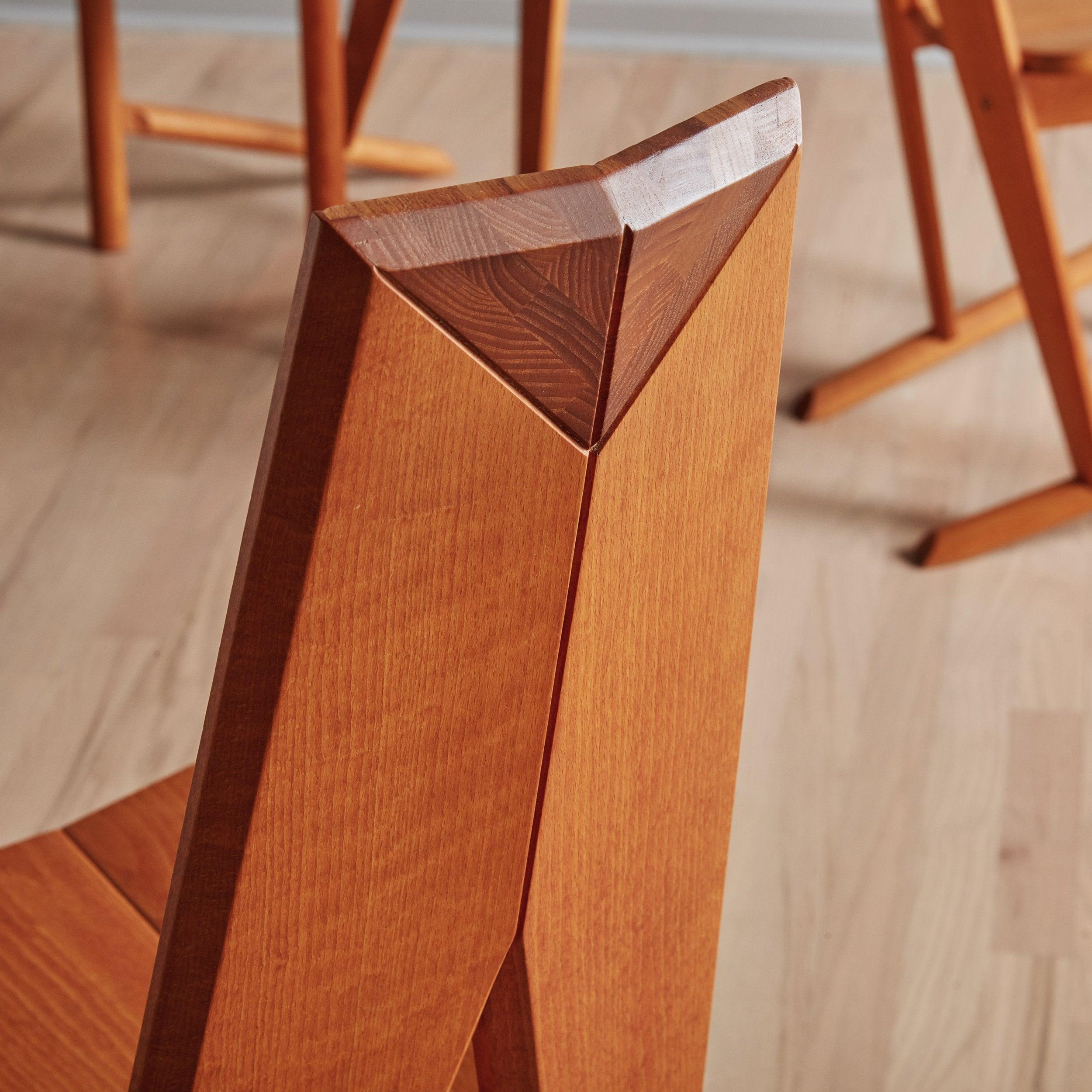 A rare Set of 6 ‘FCH1A’ solid beech wood dining chairs designed by Søren Nissen & Ebbe Gehl for Seltz in the 1980s. The warm, cherry hued beech frames feature curved, three-panel seats, angled backrests, triangular openings, and diagonal legs. The