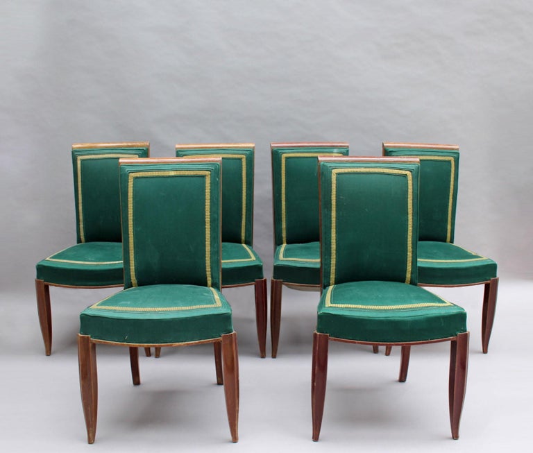 Set of six French Art Deco stained oak dining chairs.