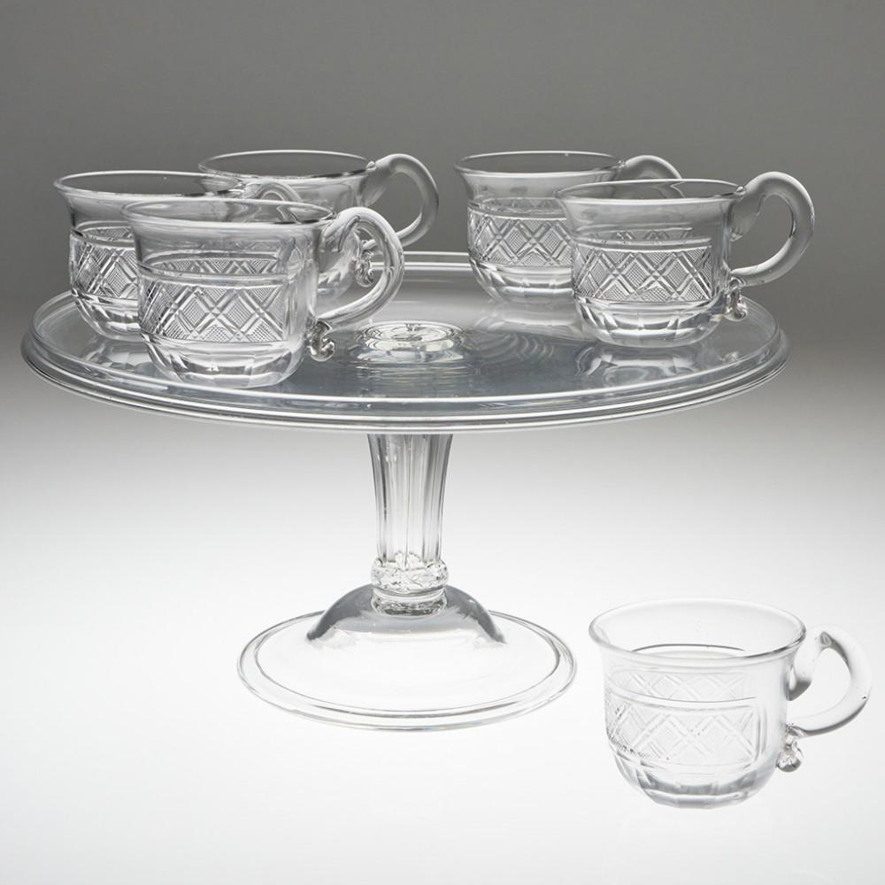 Set of 6 Finely-Cut Regency Waterford Custard Cups, c1825

Additional information: 
Period : George IV
Origin : Gatchells and Walpole, Waterford, Ireland
Colour : Clear
Bowl : Cup-shaped with slightly flared rim; applied top down handle with ribbon
