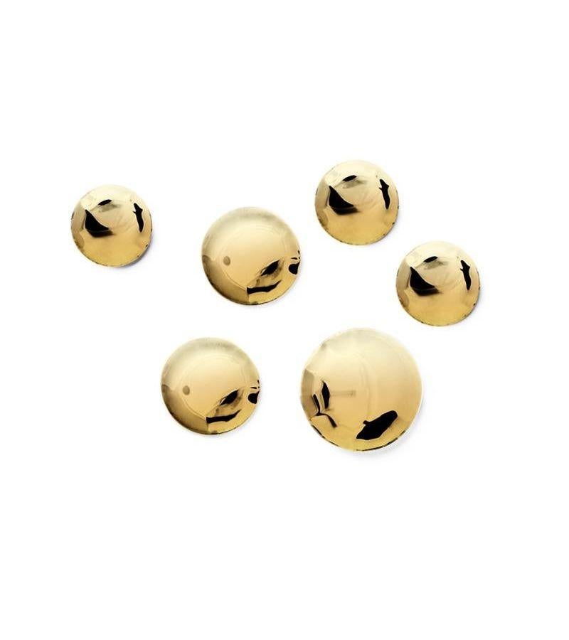 Set of 6 Flamed Gold Pin Wall Decor by Zieta
Dimensions: Diameter 10, 12, 14 cm 
Material: Stainless Steel. 
Finish: Thermal colored. Polished. Lacquered. 
Available in Cosmic Blue. Available Powder-Coated in colors: Beige Grey, Graphite, Grey