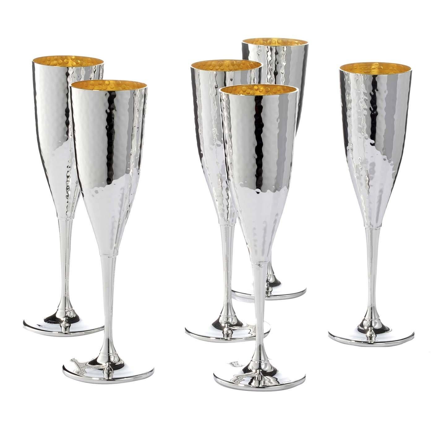 Designed to complement the wine decanters from the same series with a hand-hammered finish, this set of six flutes is silver-plated with an interior gold layer that adds a luxurious contrast of strong visual interest. A sophisticated and thoughtful