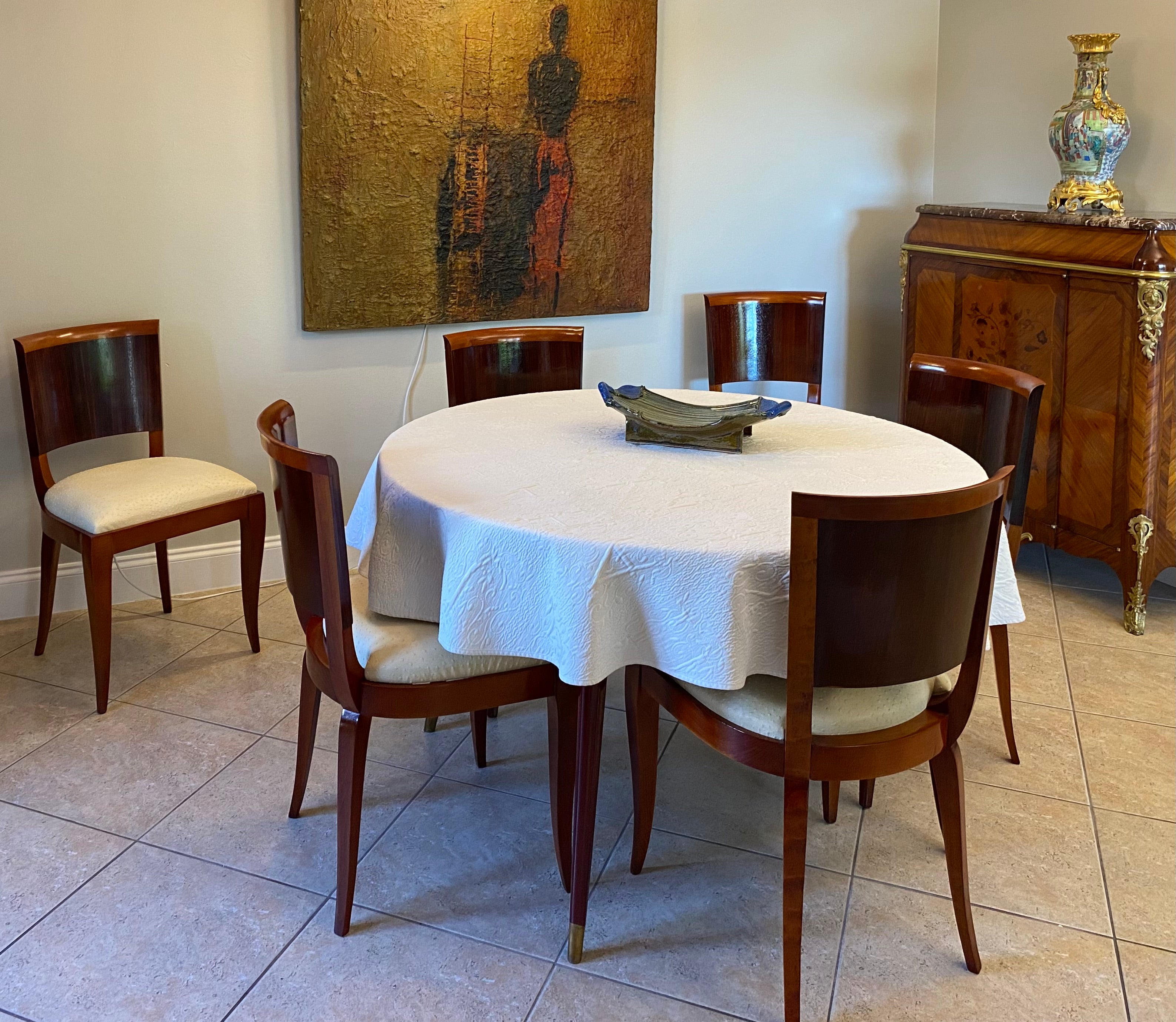 Classic and elegant set of six uniquely designed, comfortable and sturdy French Art Deco dining chairs attributed to Gaston Poisson but also made in the manner of Rene Prou (1889-1947). Conical barrel-shaped and canted seat backs over corresponding