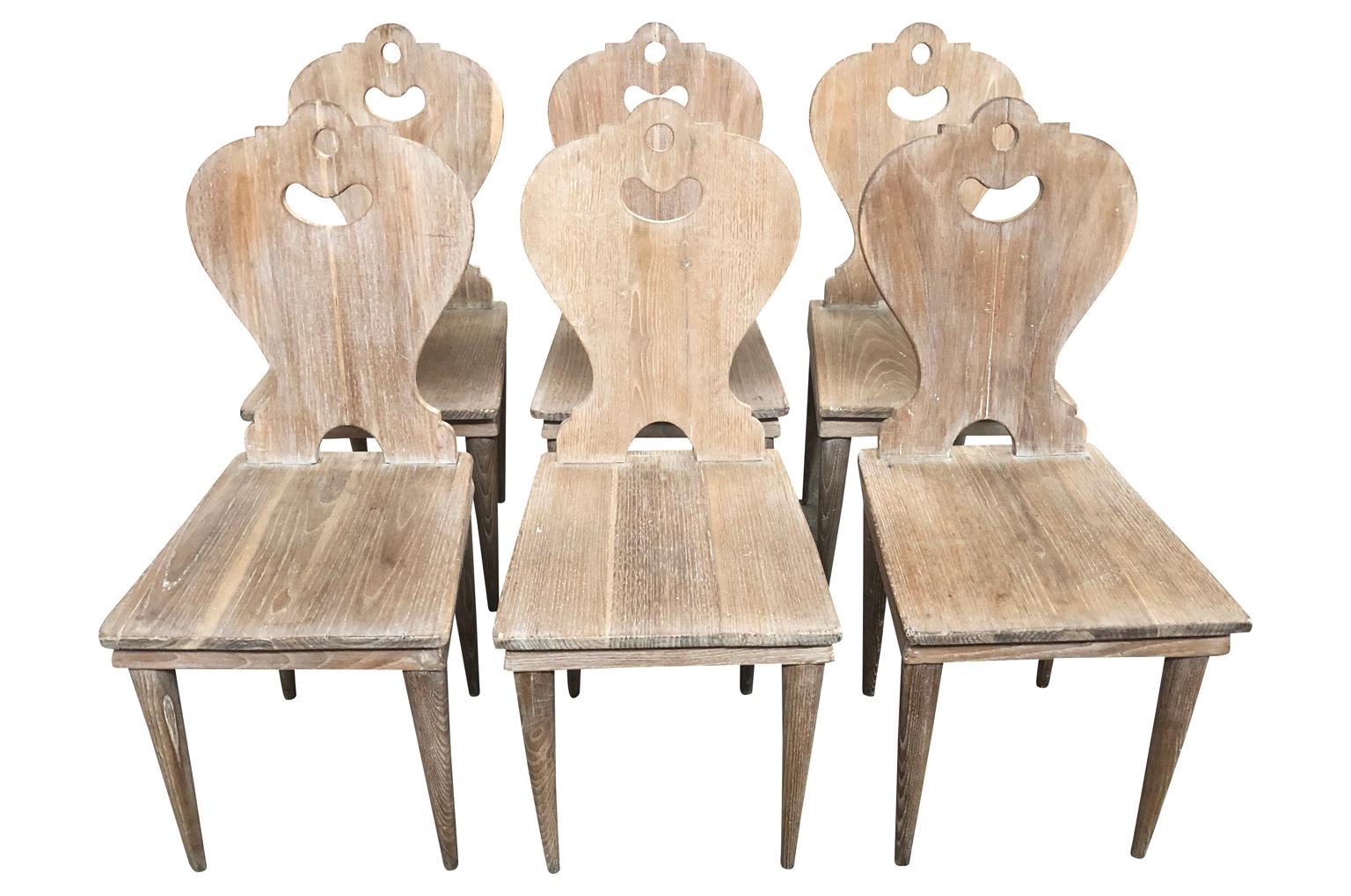 Set of 6 Arte Populaire - Folk Art dining chairs from the Ardeche region of France. Soundly constructed from scraped wood with a wonderfully shaped back and tapered legs.