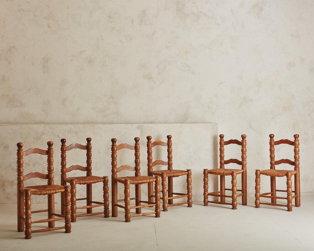 A beautiful set of 1940s French dining chairs featuring beautifully woven rush seats. France 1940s.