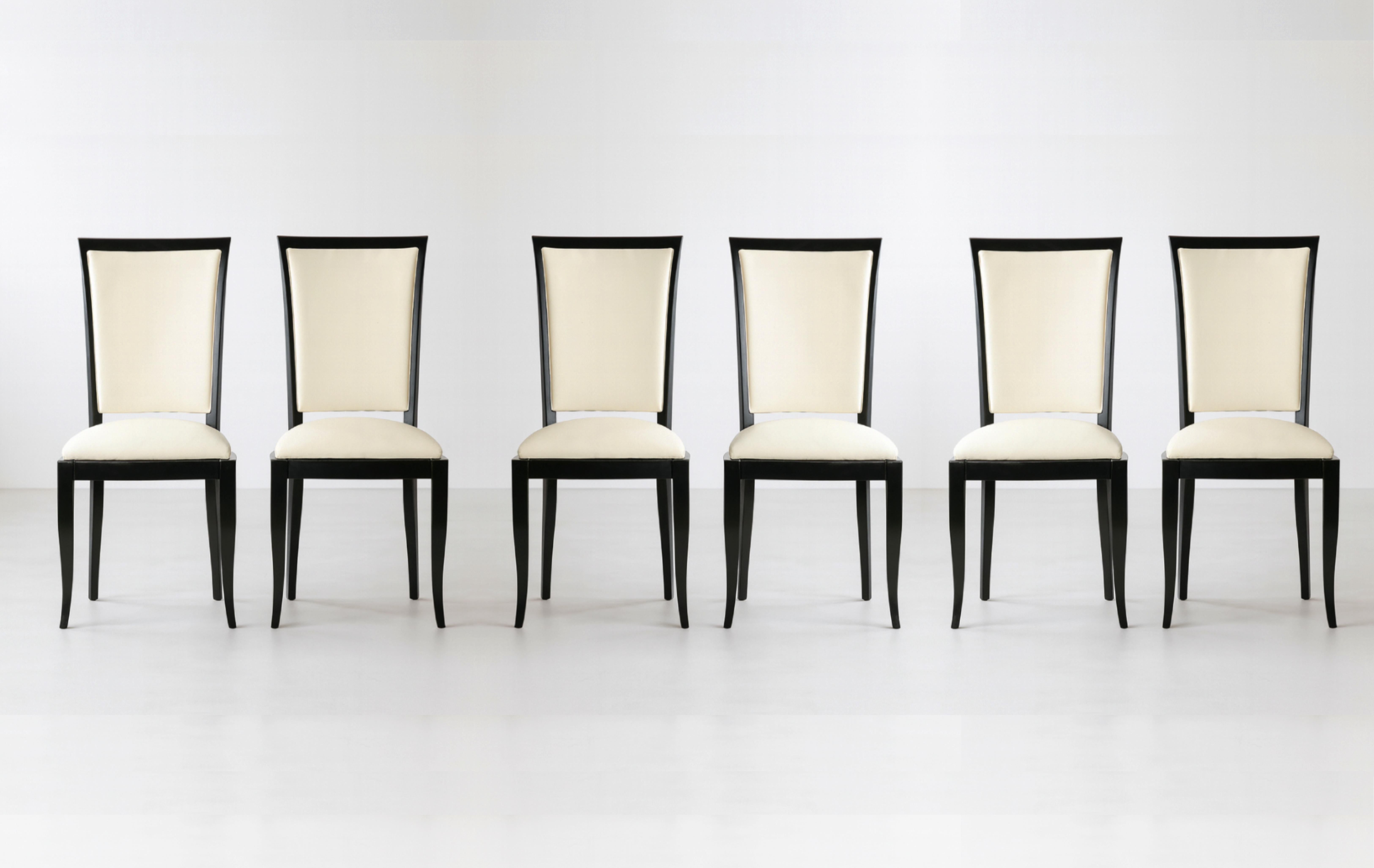 A very elegant set of six black color high gloss dining room chairs in white vinyl and polished wood finish.

We also have one more units of this piece available. Please check our listings.