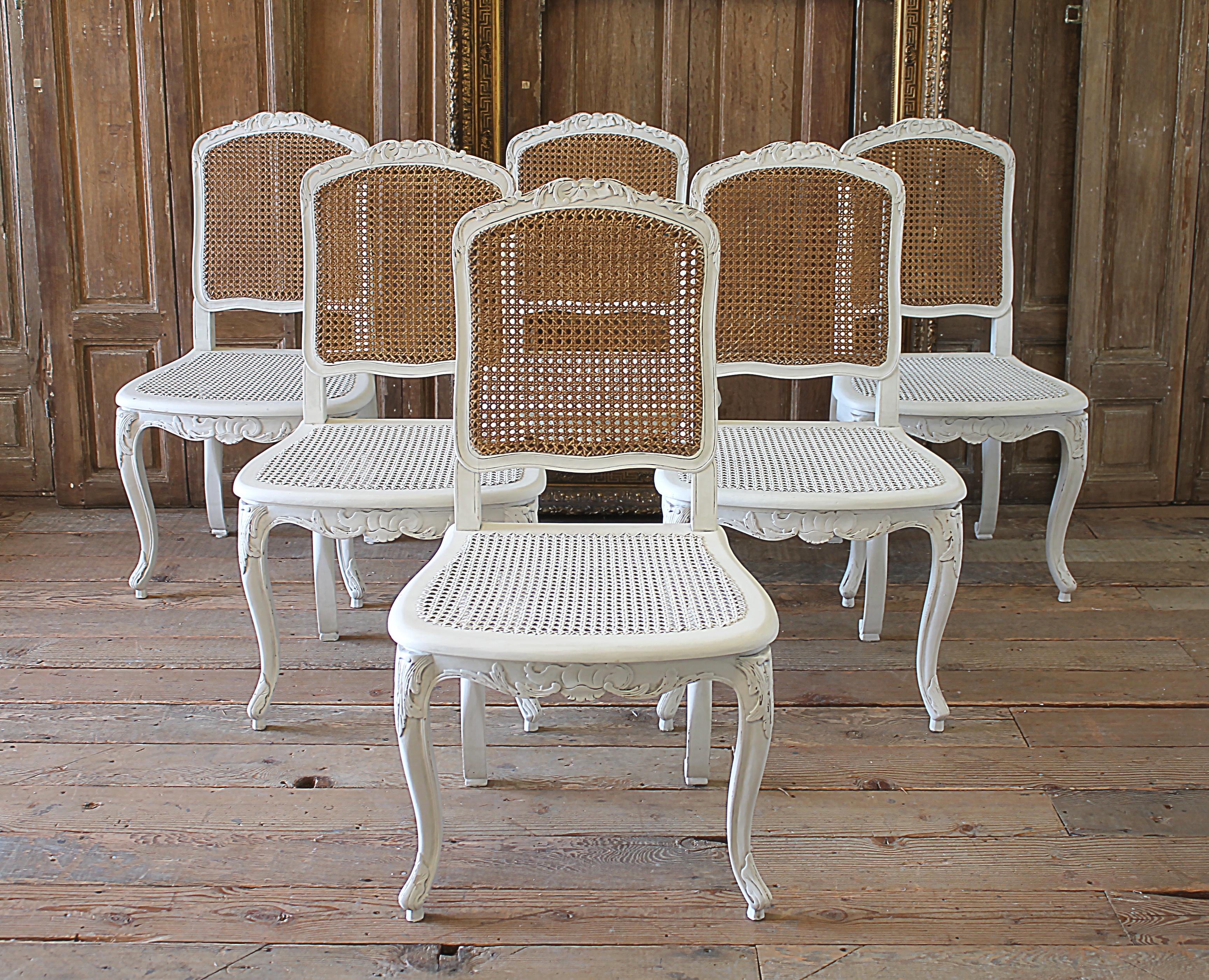 Set of 6 French Country Louis XV style cane back dining chairs
Beautiful carved French Country style cane back dining chairs painted in our soft oyster white, with subtle distressed edges, and finished with an antique glazed patina. This off white