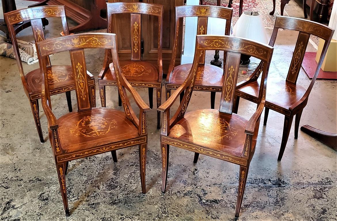 Presenting an exceptional set of 6 French Empire Marquetry chairs.

Made in France circa 1815-20.

Set consists of 2 Captains/Carvers and 4 side chairs.

Stunning marquetry throughout. Floral marquetry bouquets on each seat, scrolling floral