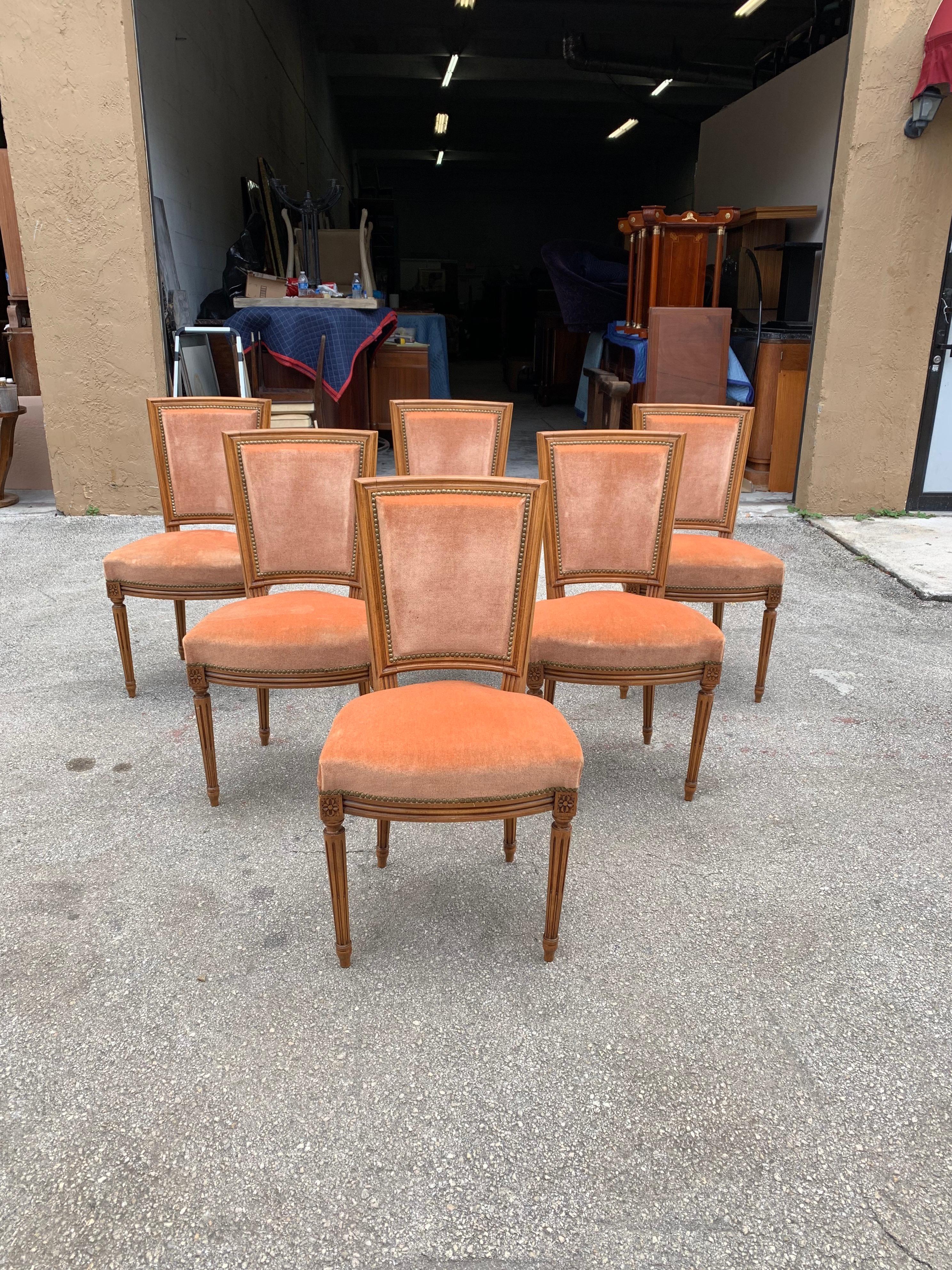 Fine set of six French Louis XVl dining chairs solid mahogany with peach color velvet, chair mahogany frames is in excellent condition. The reupholstery is original peach velvet color in very good condition all 6 dining chairs and very sturdy.