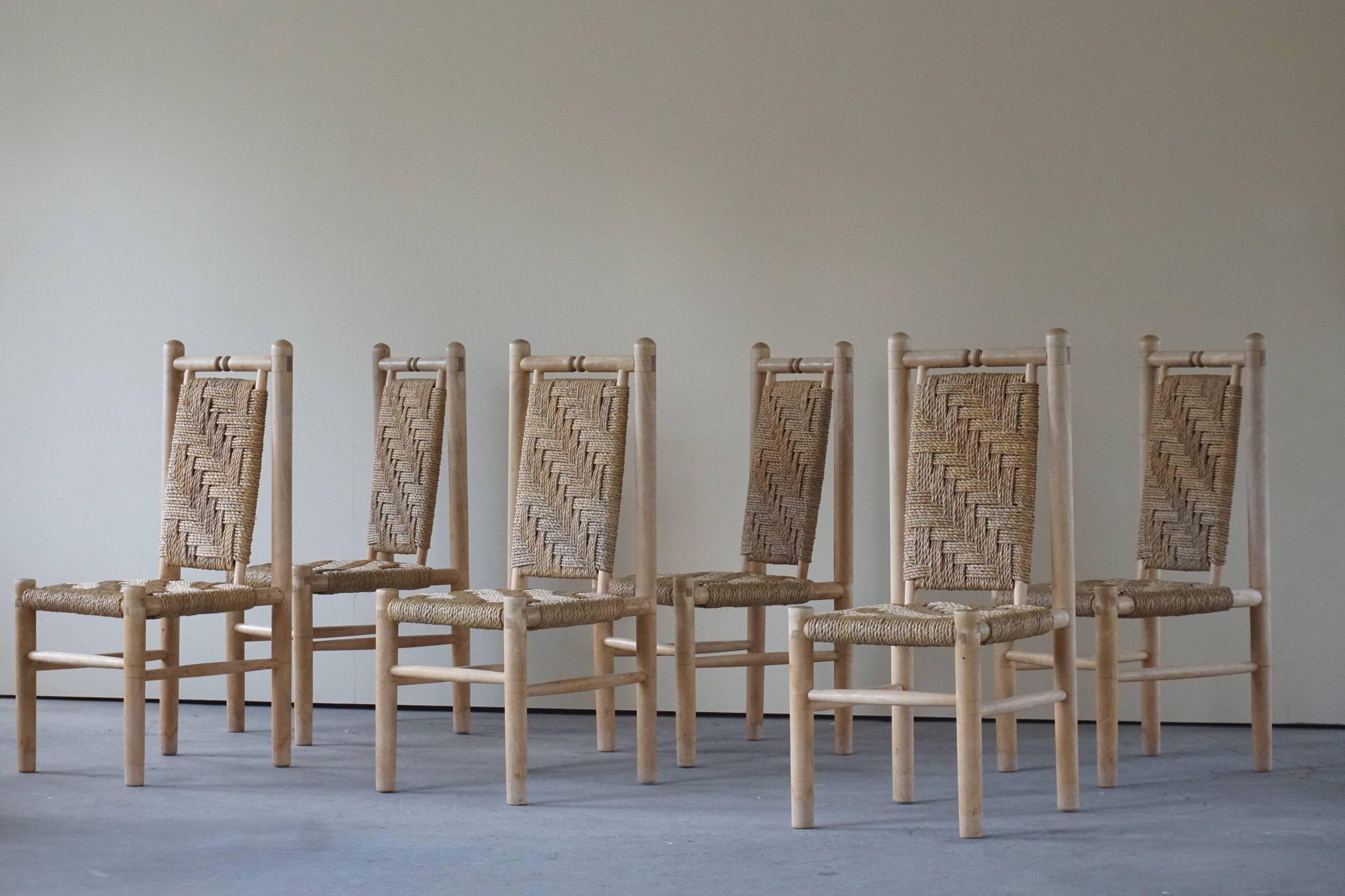 Set of 6 stunning French mid century naturalist woven highback chairs in solid elm, 1960s. Clearly inspired by Charlotte Perriand's wood and straw creations. The combination of the elm structure and the woven seat/back is an organic and stylish mix
