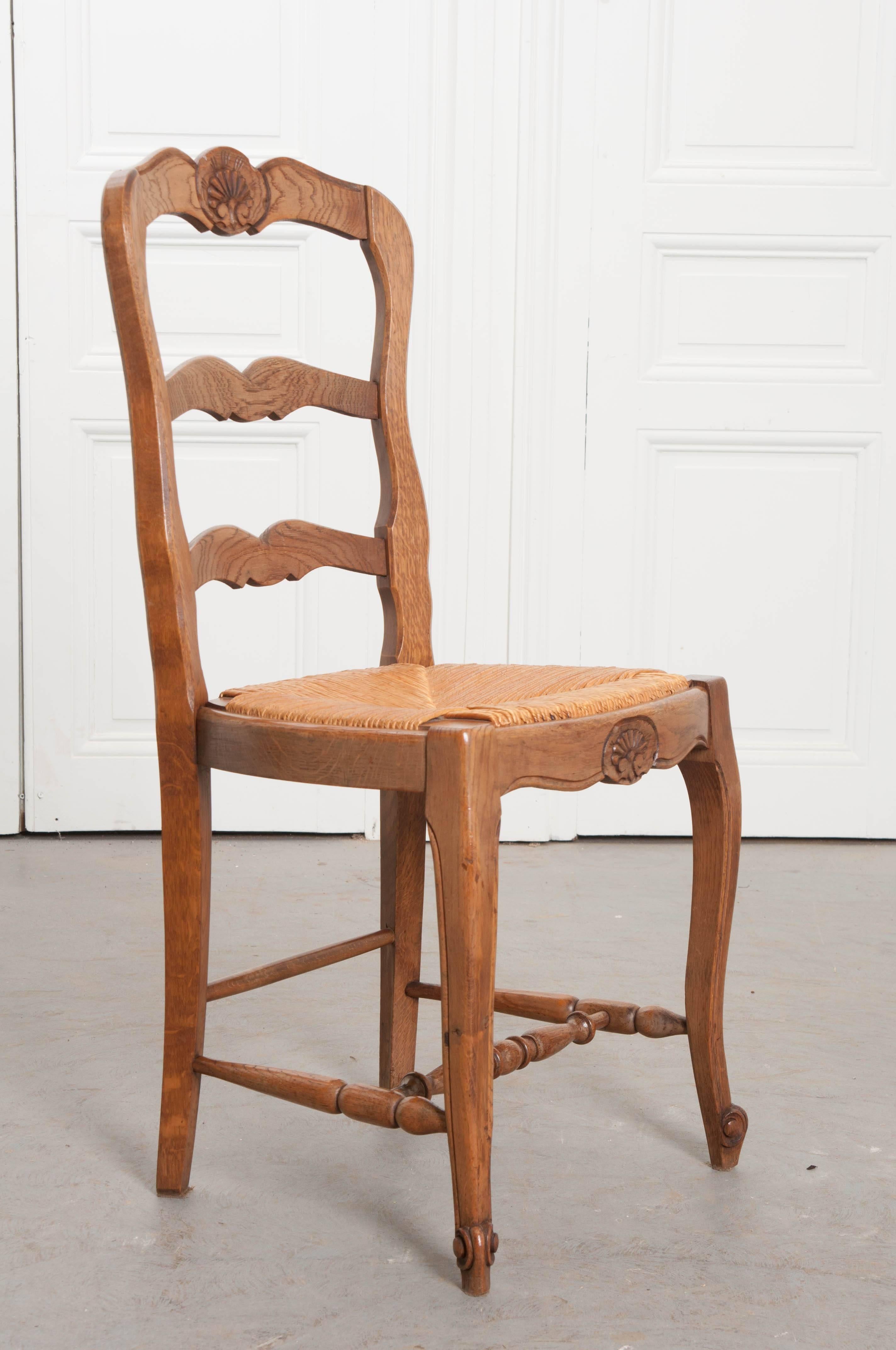 Patinated Set of Six French Oak Ladder Back Chairs with Rush Seats