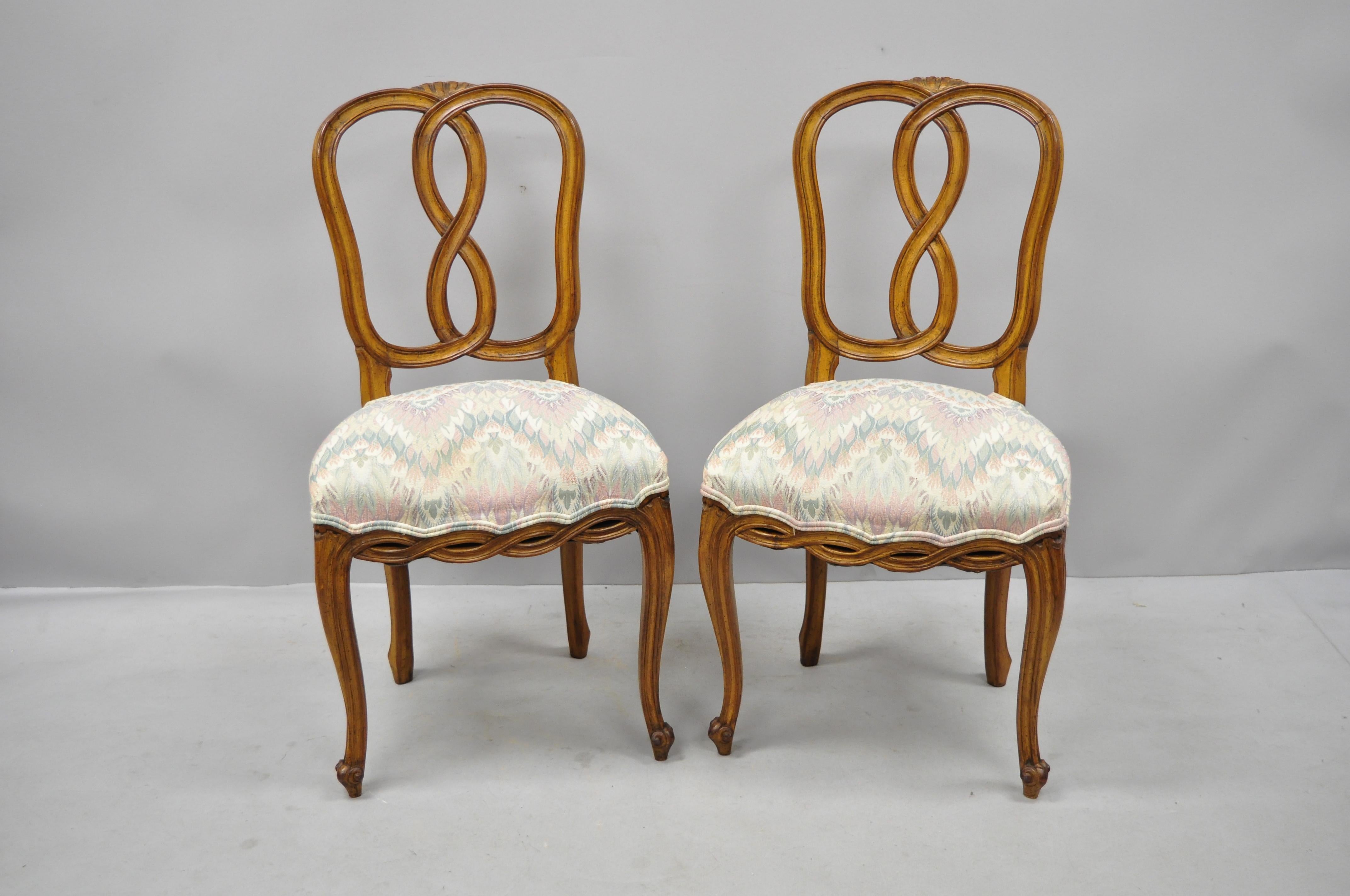 Set of 6 French Provincial style Pretzel back spiral carved dining chairs. Listing includes six side chairs, carved pretzel back, pierce spiral carved lower rails, solid wood construction, beautiful wood grain, cabriole legs, great style and form,