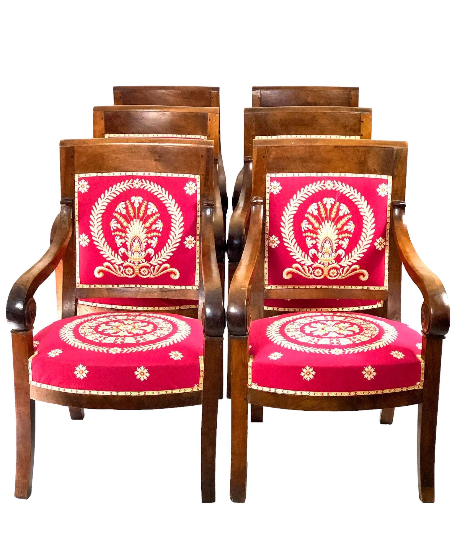 A beautiful set of six striking, crimson-upholstered Fuitwood and Lemon Tree veneer armchairs, named in french Fauteuils à Crosses, dating from the “Restauration” Period in France (1815-1830), during which time rooms and interiors were being